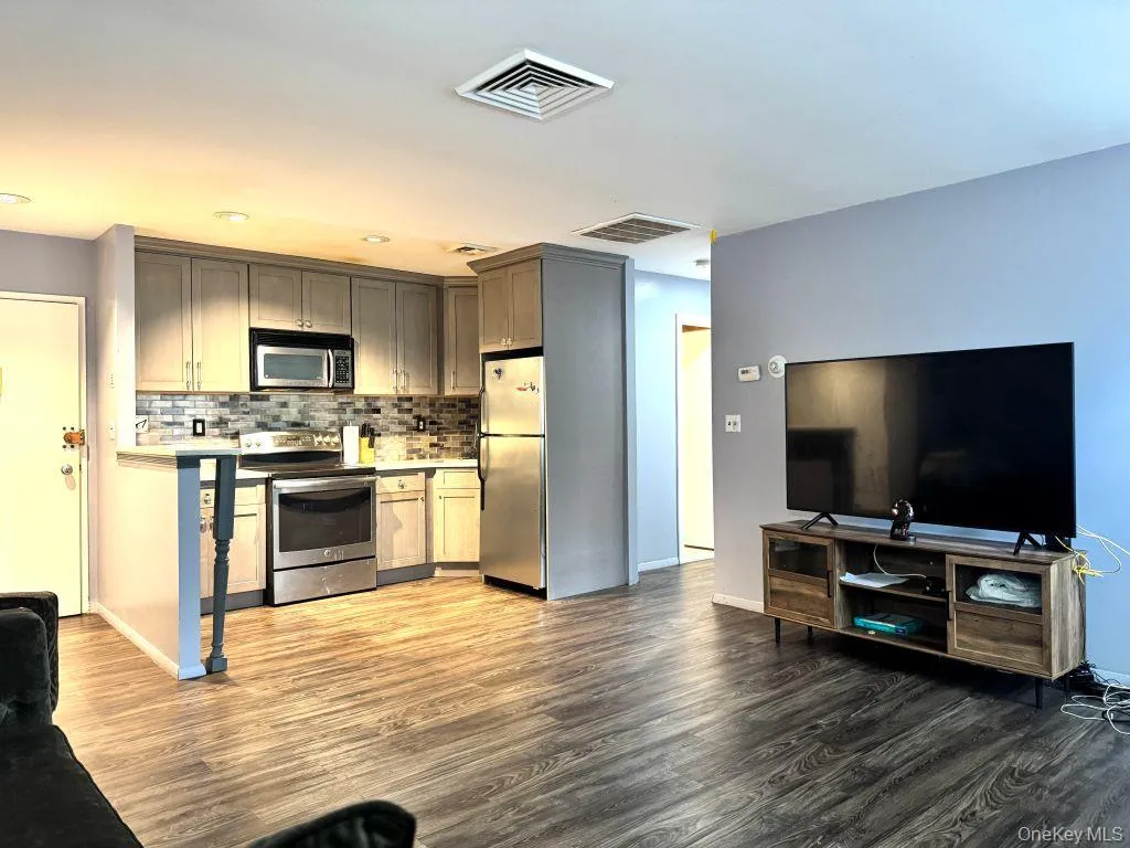 Open concept living room into kitchen Open concept living room into kitchen