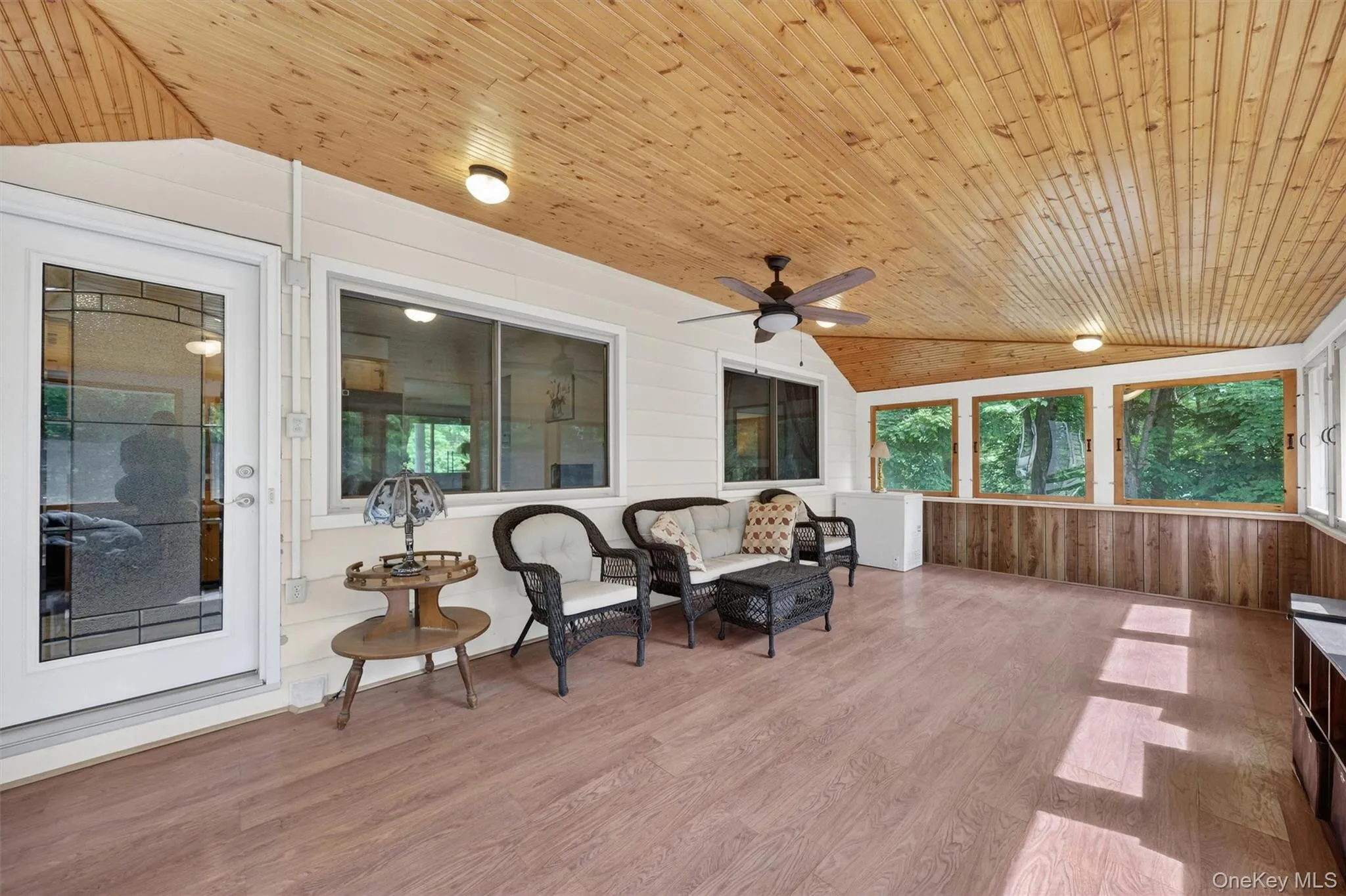 Three Season room withGlass Door Entry to Kitchen. Three Season room withGlass Door Entry to Kitchen.