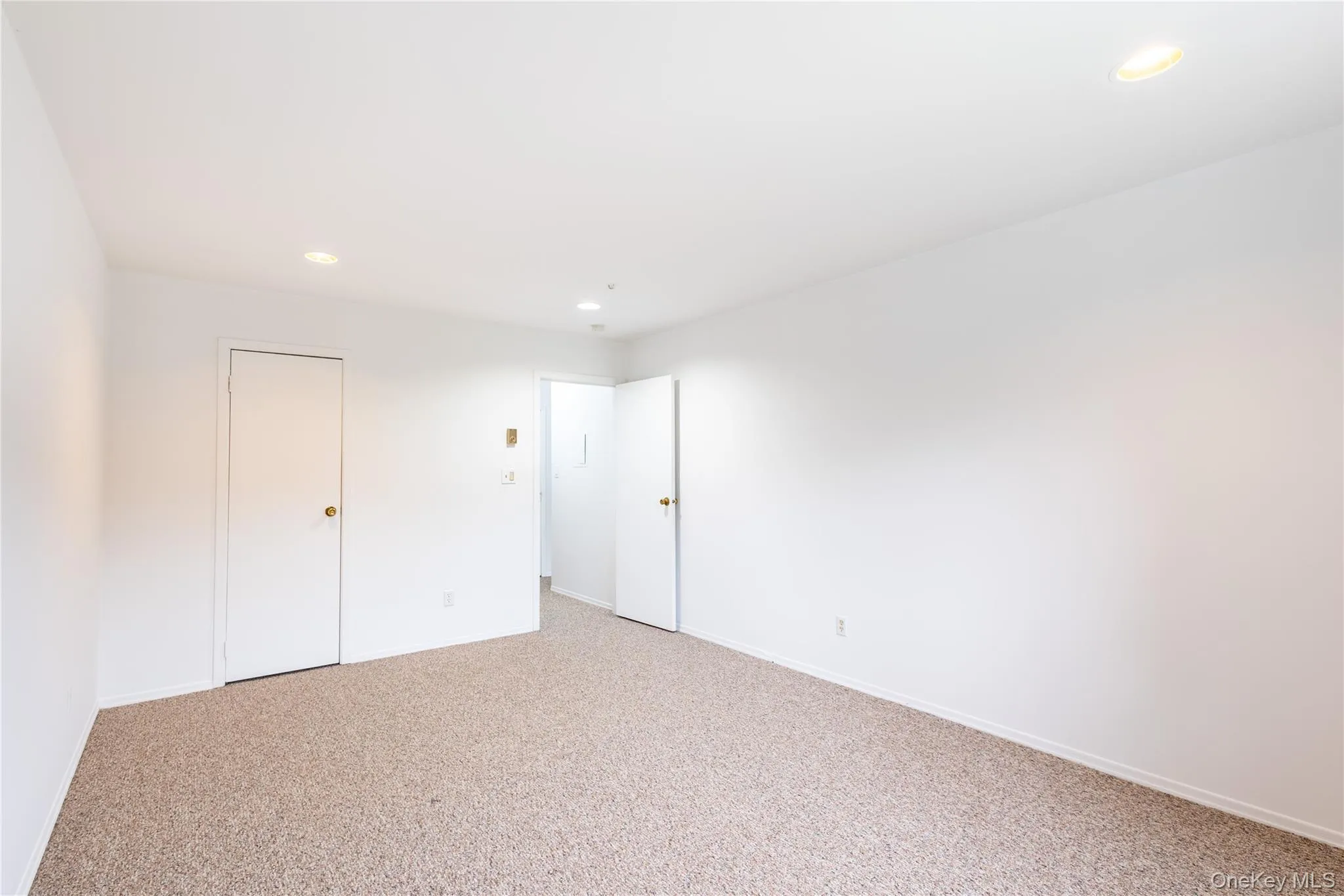 King size bedroom looking toward front of unit - walk in closet King size bedroom looking toward front of unit - walk in closet