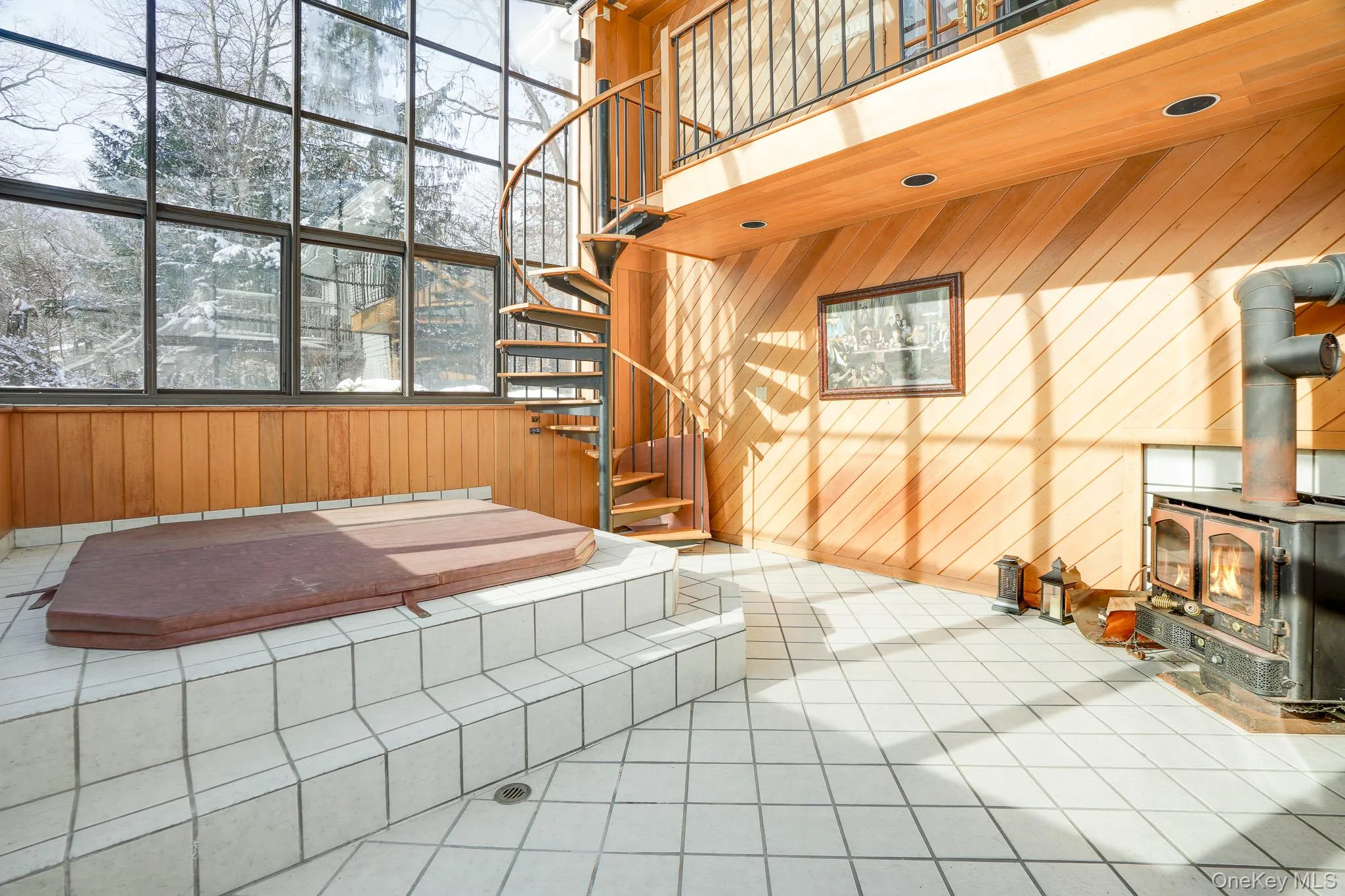 Spiral stairs leading to the hot tub and pellet stove. Spiral stairs leading to the hot tub and pellet stove.