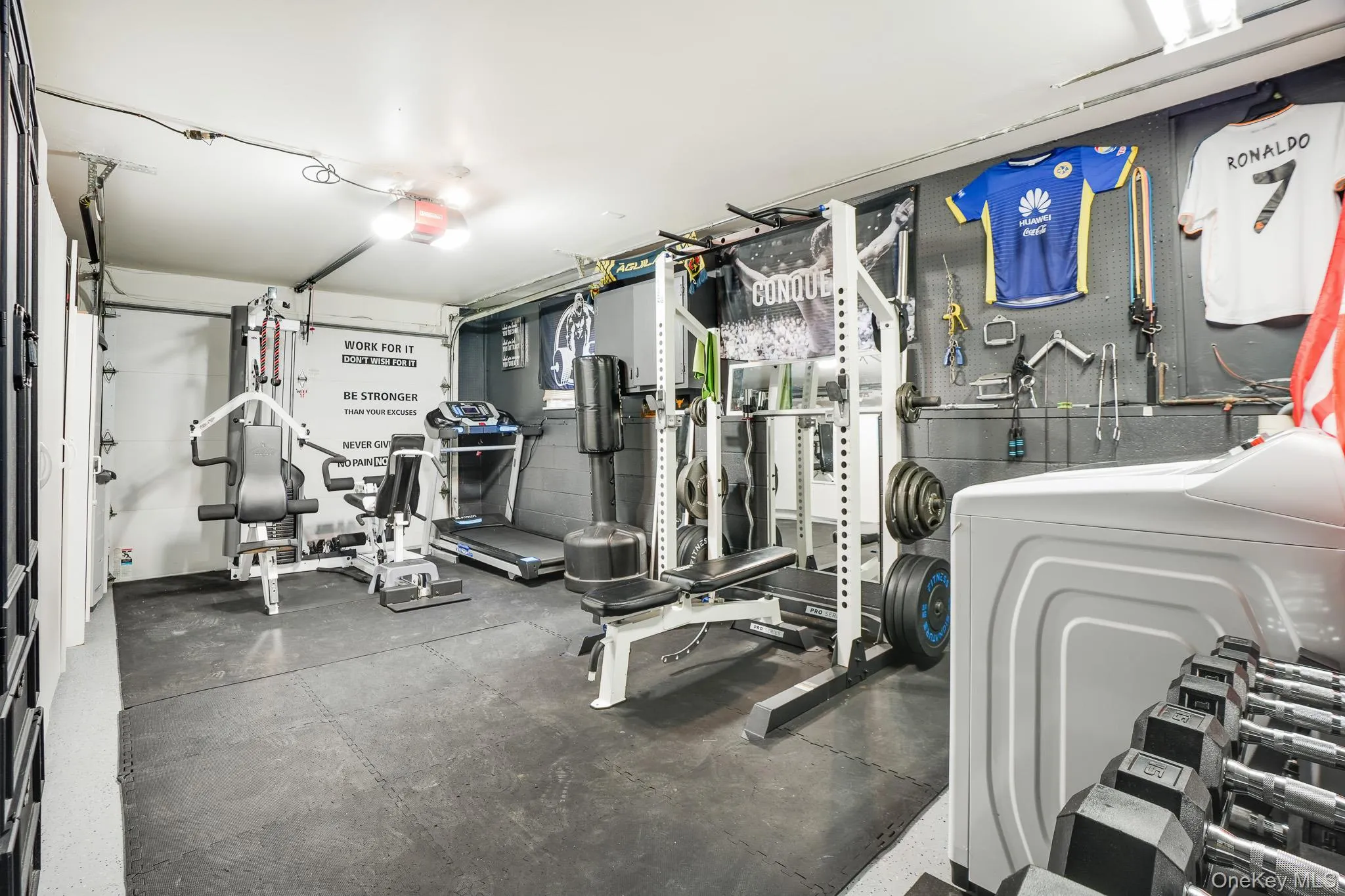 Garage, currently being used as a home gym. Garage, currently being used as a home gym.