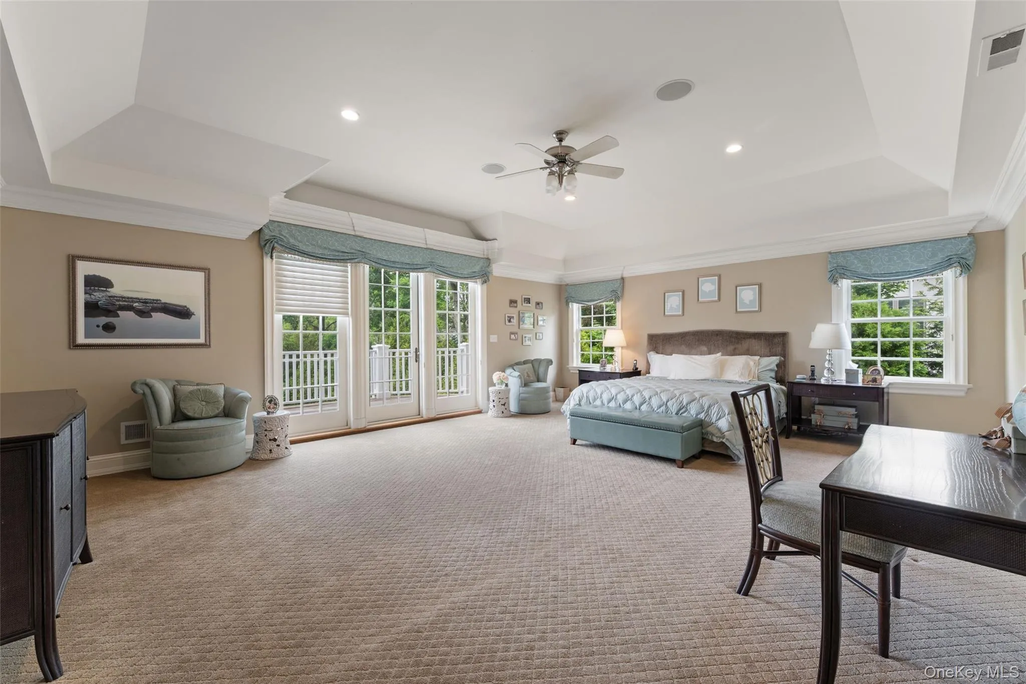 Primary Bedroom with vaulted ceilings and balcony Primary Bedroom with vaulted ceilings and balcony