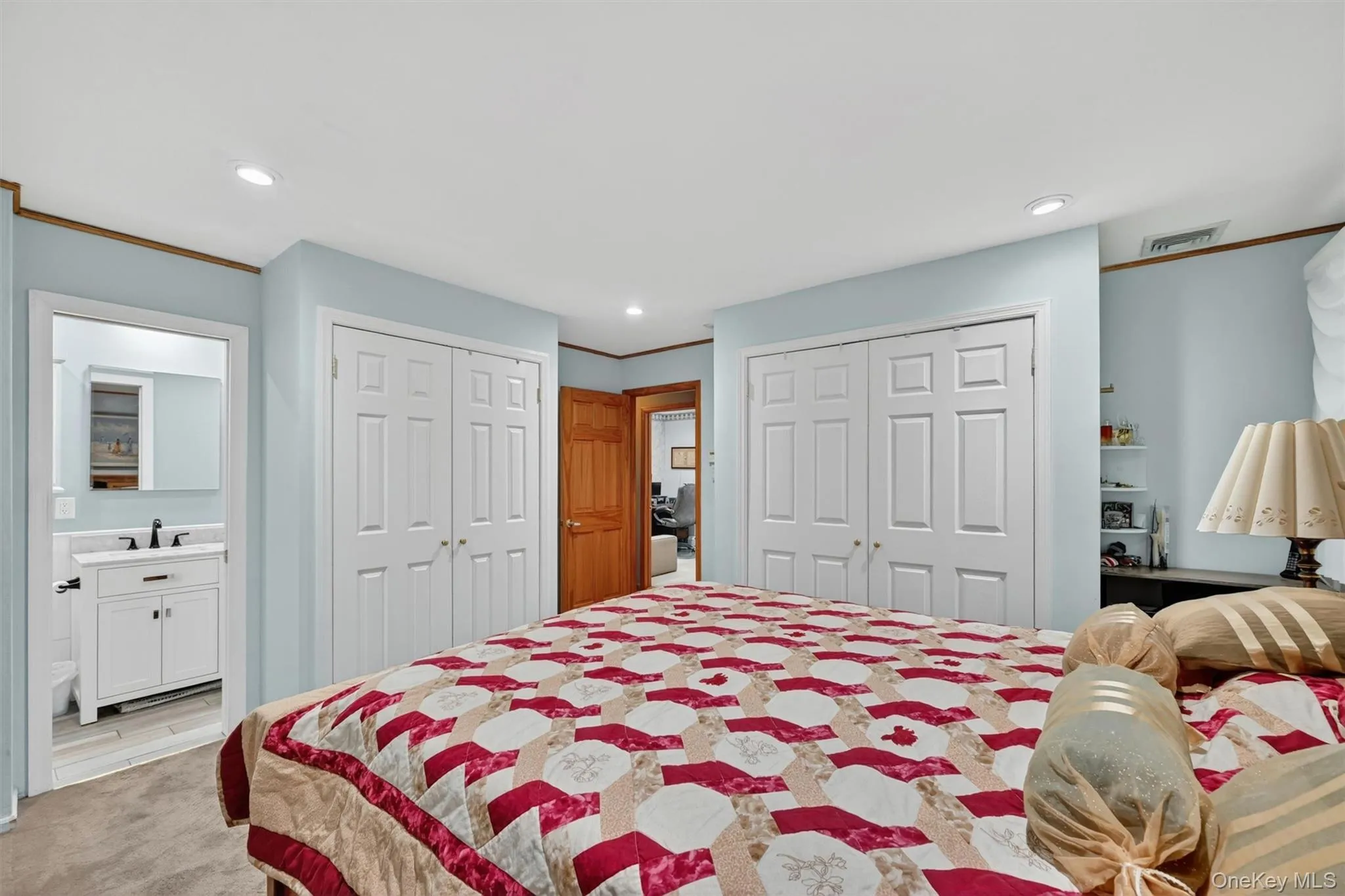 Comfortable primary suite with ample room for furnishings, neutral tones, and convenient access to the en-suite bath. Comfortable primary suite with ample room for furnishings, neutral tones, and convenient access to the en-suite bath.