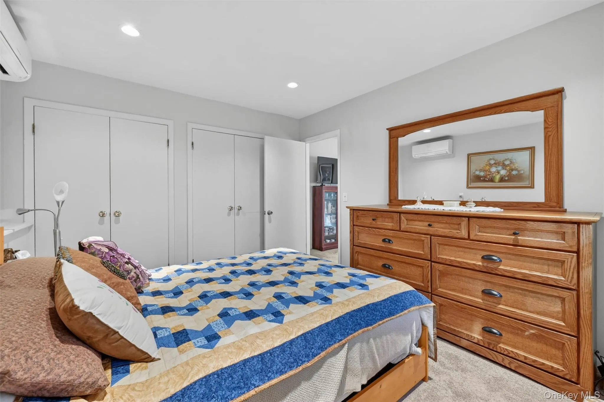 FIFTH BEDROOM: Spacious lower-level bedroom with a flexible layout, mini-split heating and cooling, and a peaceful setting for rest and relaxation. FIFTH BEDROOM: Spacious lower-level bedroom with a flexible layout, mini-split heating and cooling, and a peaceful setting for rest and relaxation.