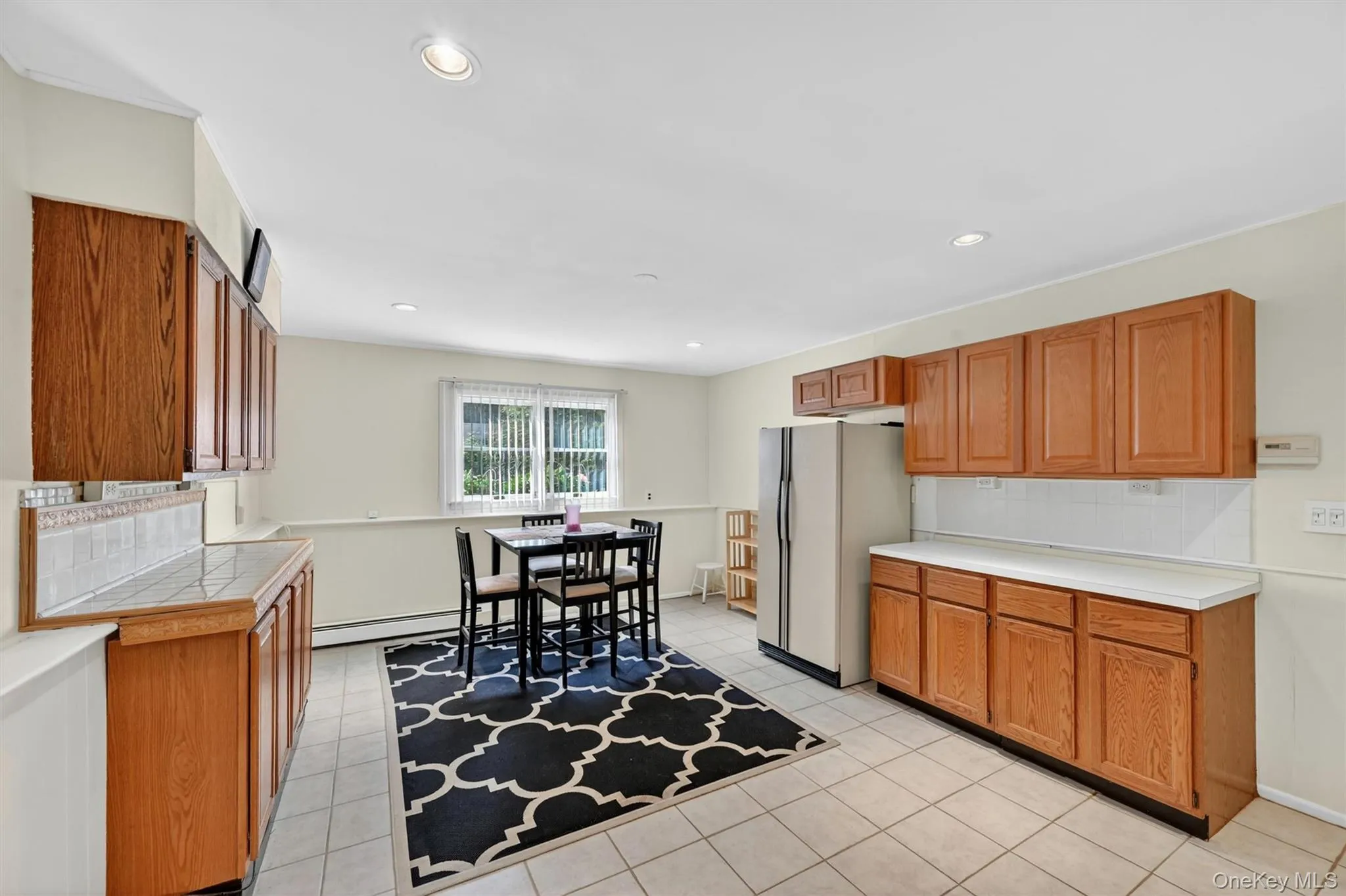 Spacious lower-level kitchen with abundant cabinetry, ample counter space, and room for casual dining. Spacious lower-level kitchen with abundant cabinetry, ample counter space, and room for casual dining.