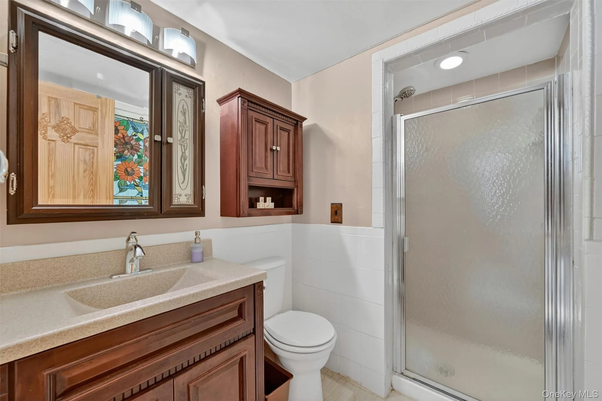 THIRD FULL BATHROOM: Convenient and spacious with vanity, updated fixtures, and a walk-in shower for added comfort and functionality. THIRD FULL BATHROOM: Convenient and spacious with vanity, updated fixtures, and a walk-in shower for added comfort and functionality.
