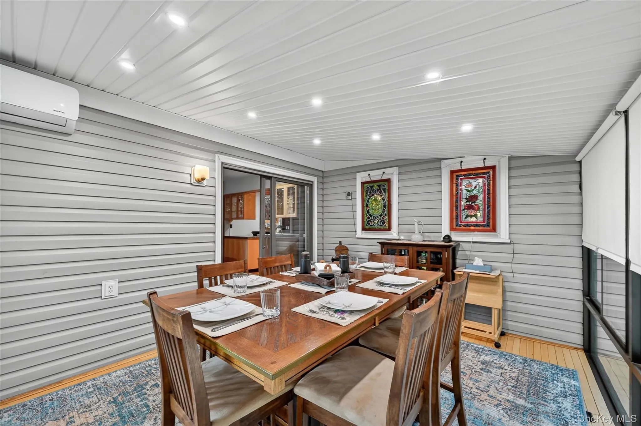 Versatile four-season sunroom with electric heating and cooling, ideal for dining, entertaining, or relaxing while enjoying the surrounding views. Versatile four-season sunroom with electric heating and cooling, ideal for dining, entertaining, or relaxing while enjoying the surrounding views.
