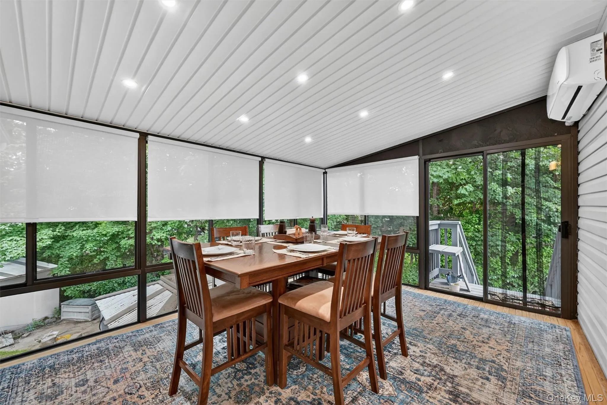 Enjoy year-round comfort in this bright and airy sunroom, featuring heating and cooling, panoramic views, and seamless access to the outdoors. Enjoy year-round comfort in this bright and airy sunroom, featuring heating and cooling, panoramic views, and seamless access to the outdoors.