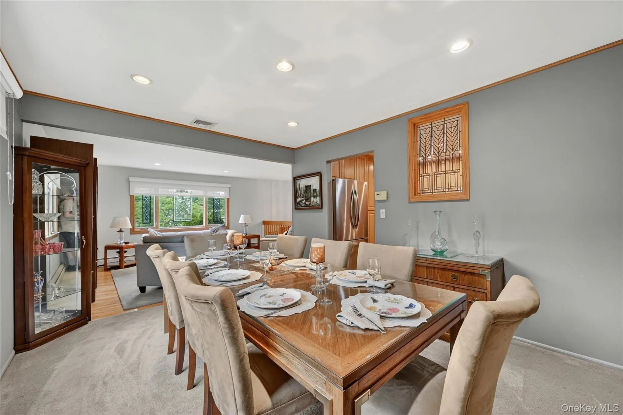 Formal dining area featuring an open layout, beautiful outdoor views, and seamless flow to the adjoining living spaces. Formal dining area featuring an open layout, beautiful outdoor views, and seamless flow to the adjoining living spaces.