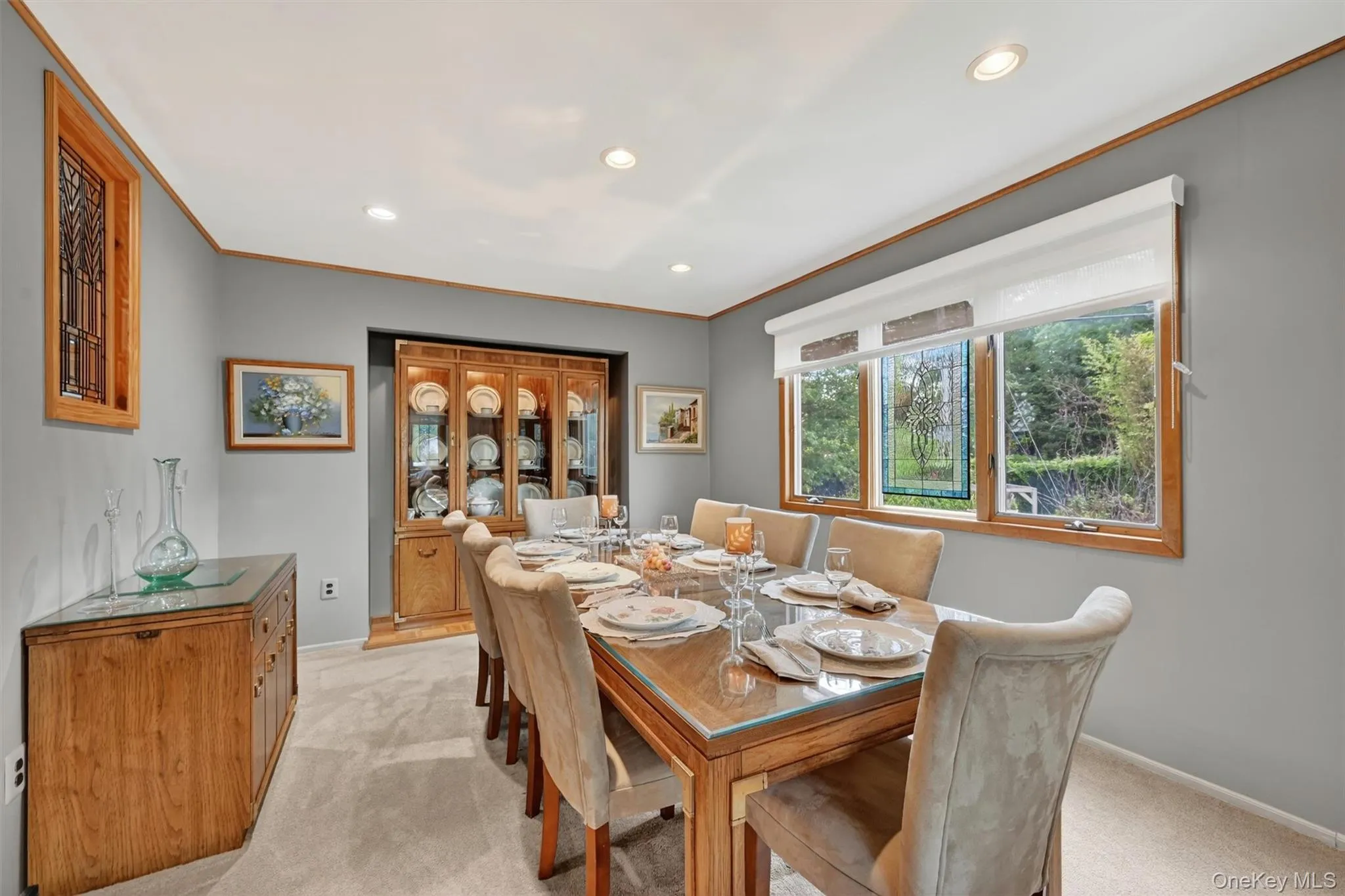 Elegant dining room with a large picture window, abundant natural light, and plenty of space for hosting family and friends. Elegant dining room with a large picture window, abundant natural light, and plenty of space for hosting family and friends.