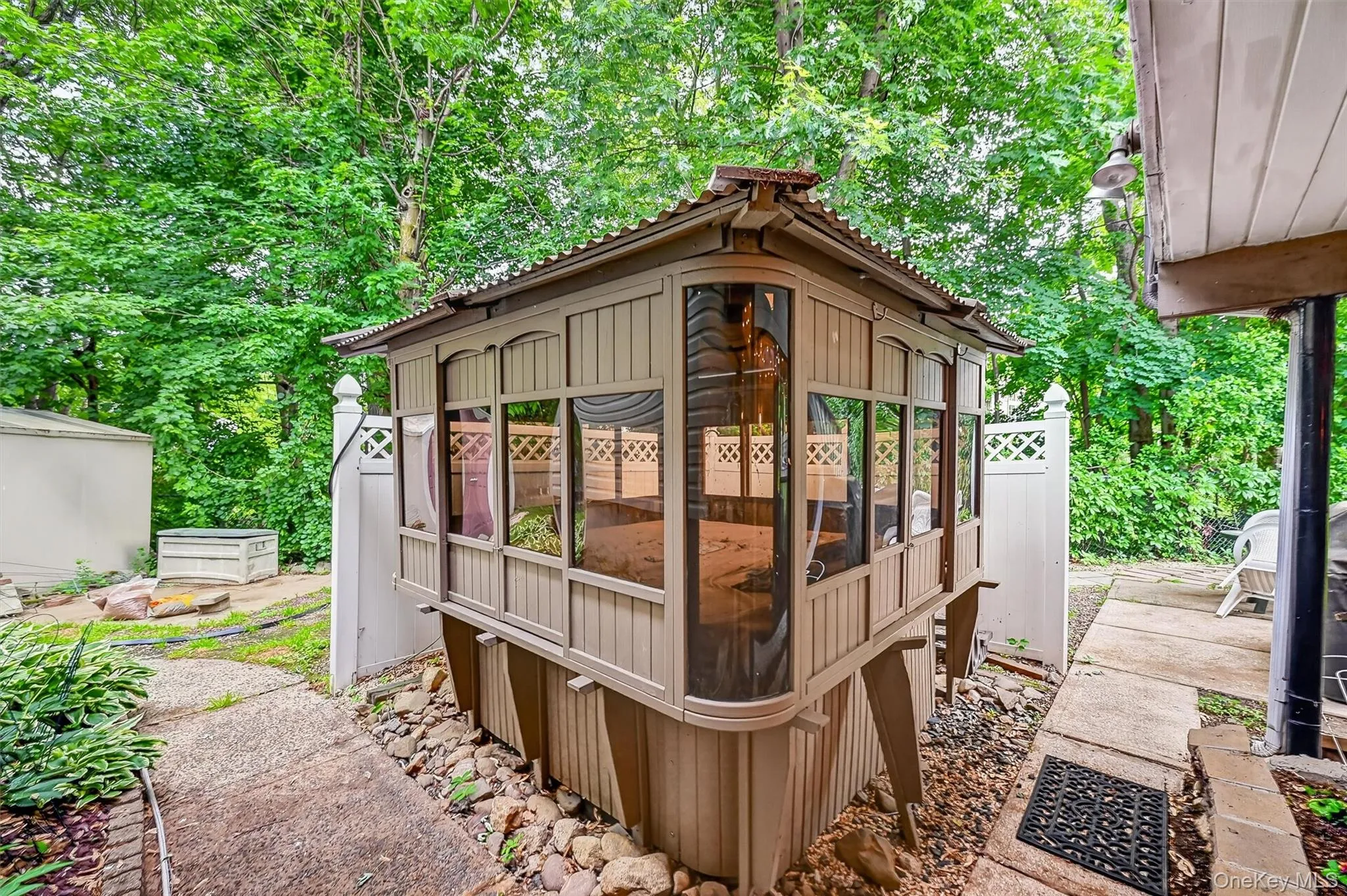 Enclosed hot tub pavilion provides a private setting for relaxation and enjoyment throughout the seasons. Enclosed hot tub pavilion provides a private setting for relaxation and enjoyment throughout the seasons.
