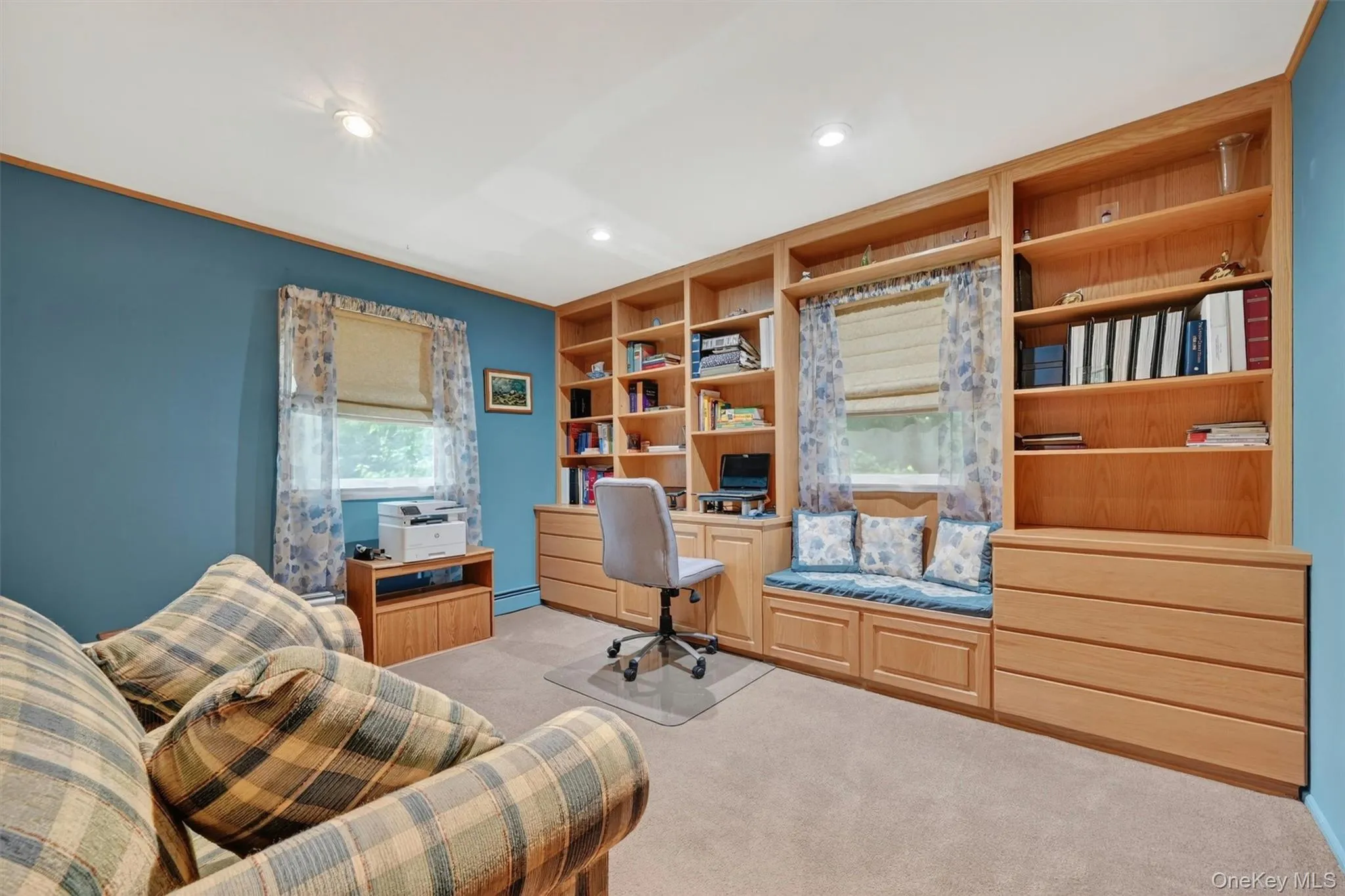 SECOND BEDROOM: Featuring custom built-in shelving and cabinetry. SECOND BEDROOM: Featuring custom built-in shelving and cabinetry.