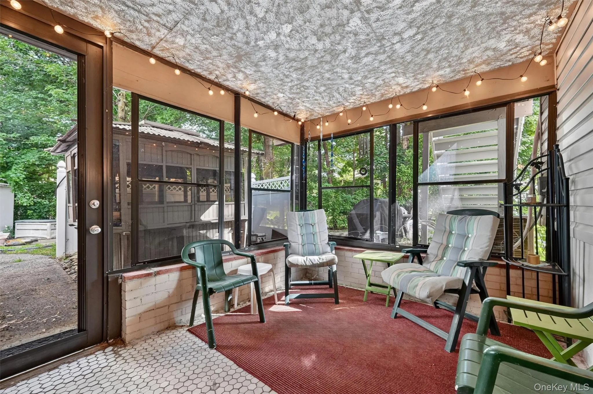 Relax and enjoy the outdoors from this spacious screened porch, offering a peaceful setting, wooded views, and protection from the elements for three-season enjoyment. Relax and enjoy the outdoors from this spacious screened porch, offering a peaceful setting, wooded views, and protection from the elements for three-season enjoyment.
