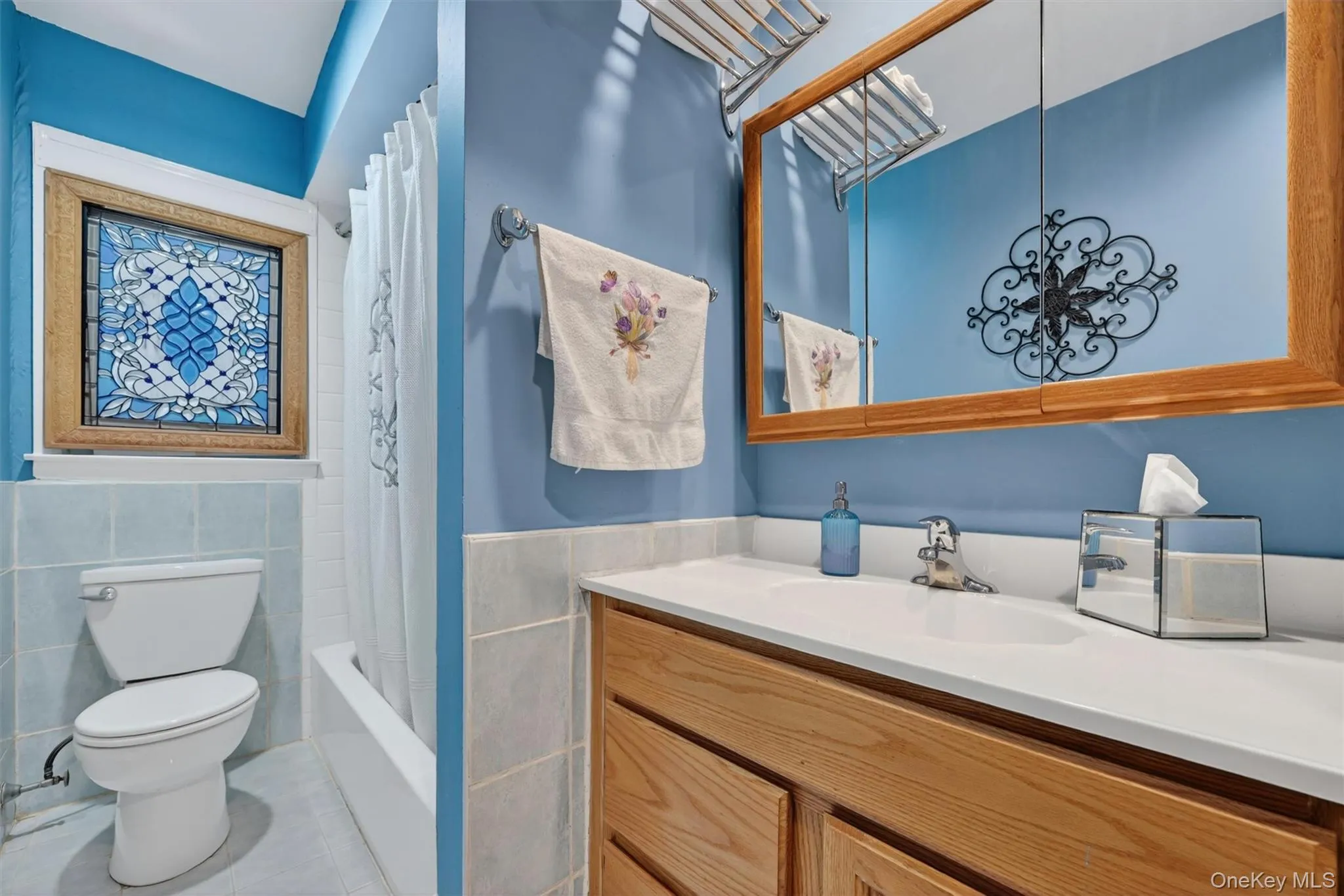 Well-maintained full bathroom featuring a spacious vanity tub/shower combination. Well-maintained full bathroom featuring a spacious vanity tub/shower combination.
