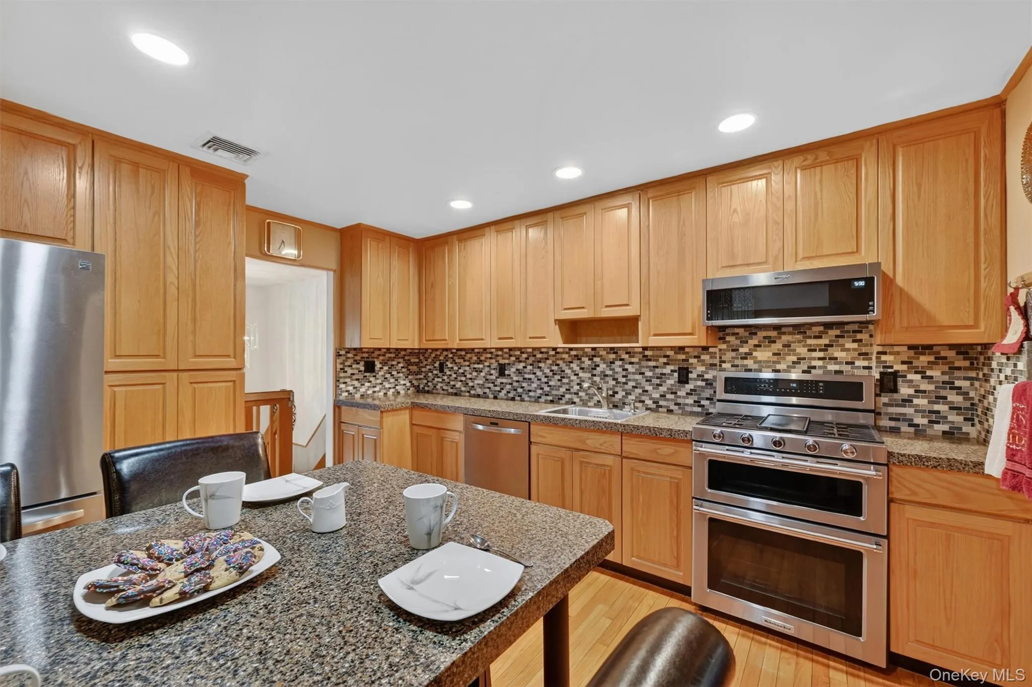 Bright and functional eat-in kitchen offering ample cabinet storage, stainless steel appliances, and room for everyday dining. Bright and functional eat-in kitchen offering ample cabinet storage, stainless steel appliances, and room for everyday dining.
