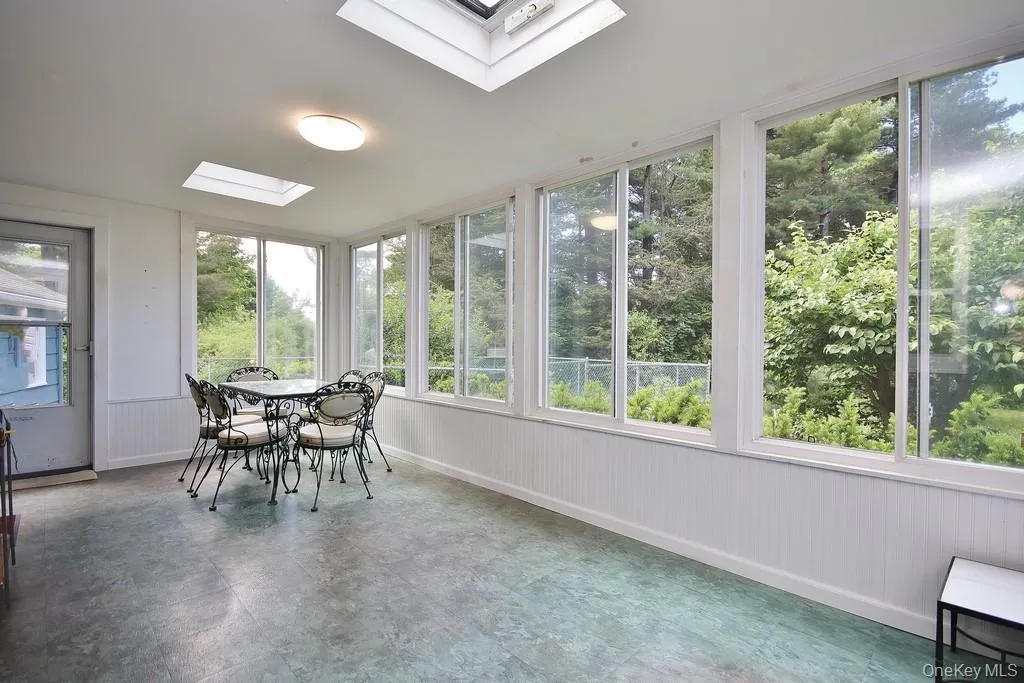 Enclosed porch has two skylights Enclosed porch has two skylights