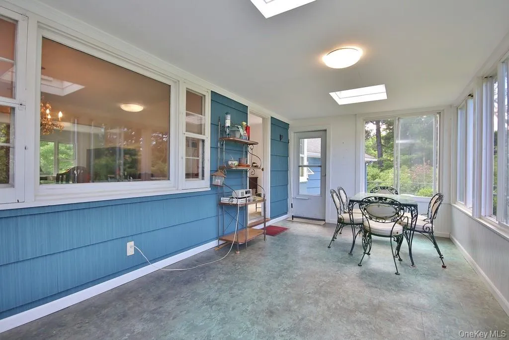 Enclosed porch has a door to outside Enclosed porch has a door to outside