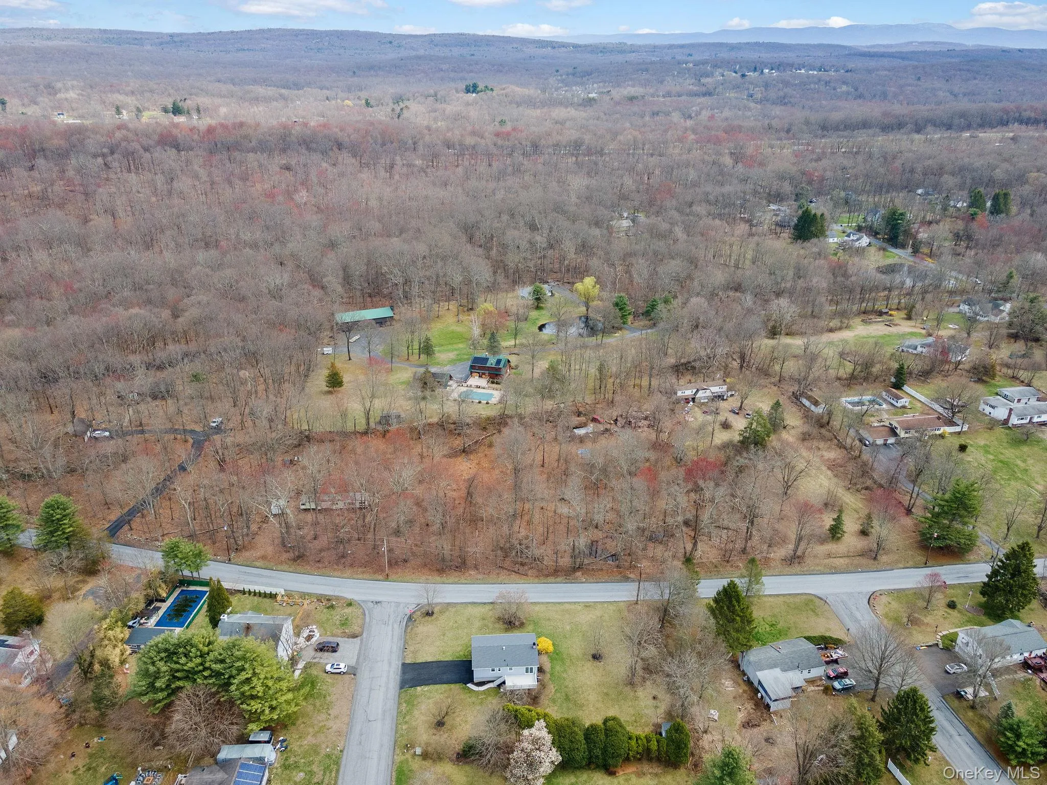 Aerial view featuring a view of trees Aerial view featuring a view of trees