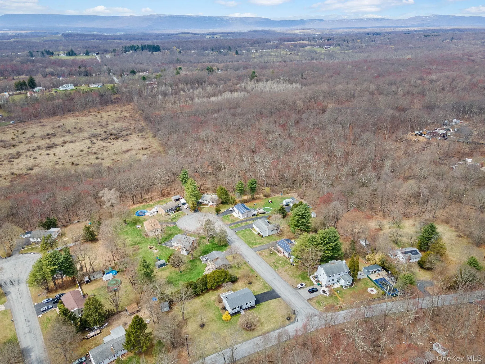 Birds eye view of property featuring a view of trees Birds eye view of property featuring a view of trees