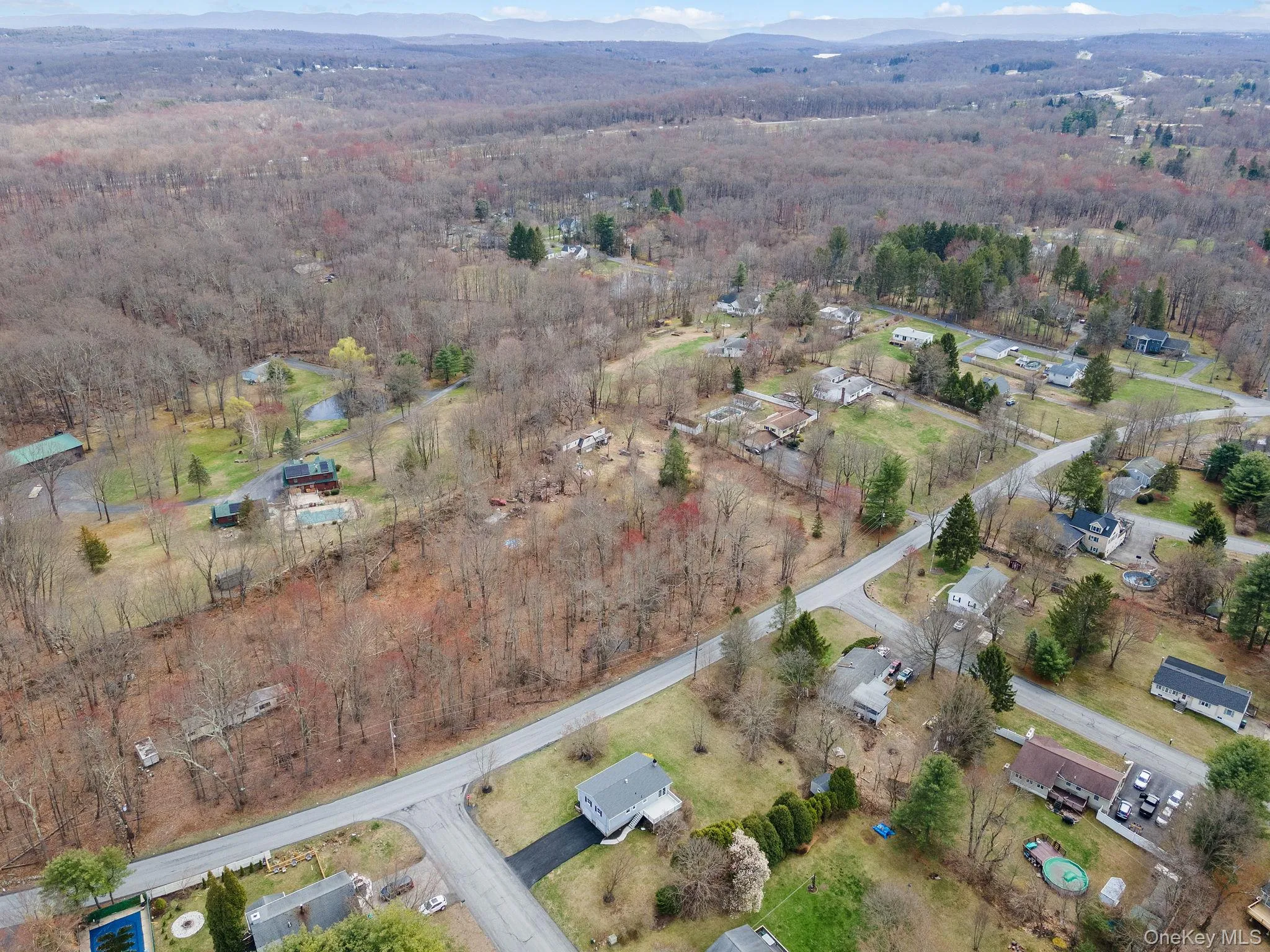 Birds eye view of property with a forest view Birds eye view of property with a forest view