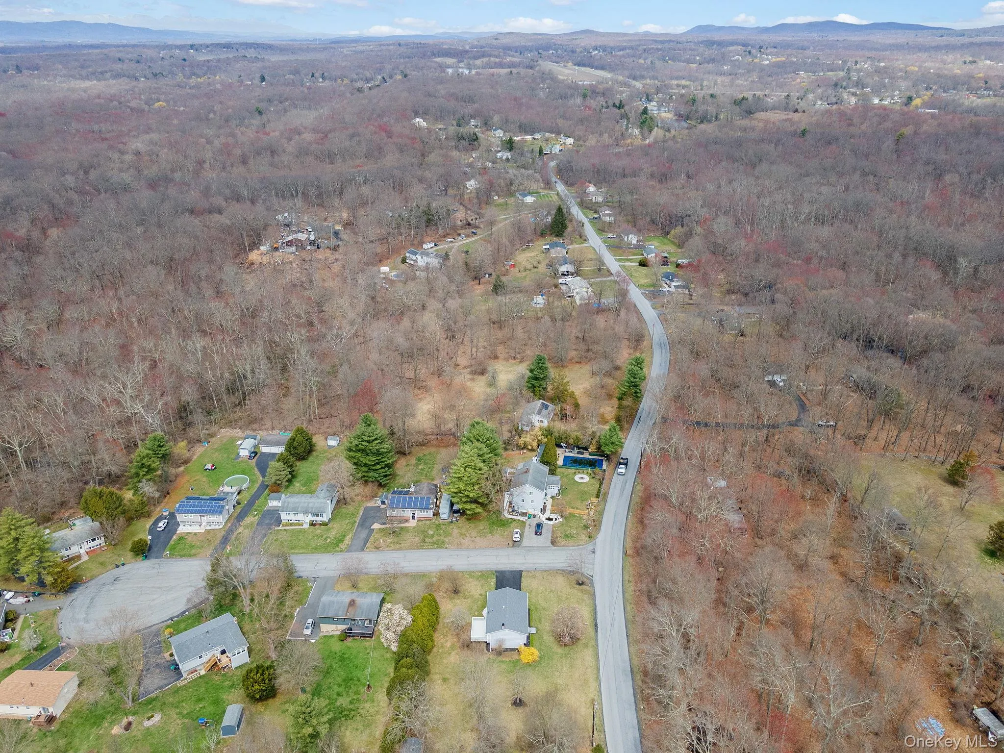Bird's eye view featuring a forest view and a mountain view Bird's eye view featuring a forest view and a mountain view