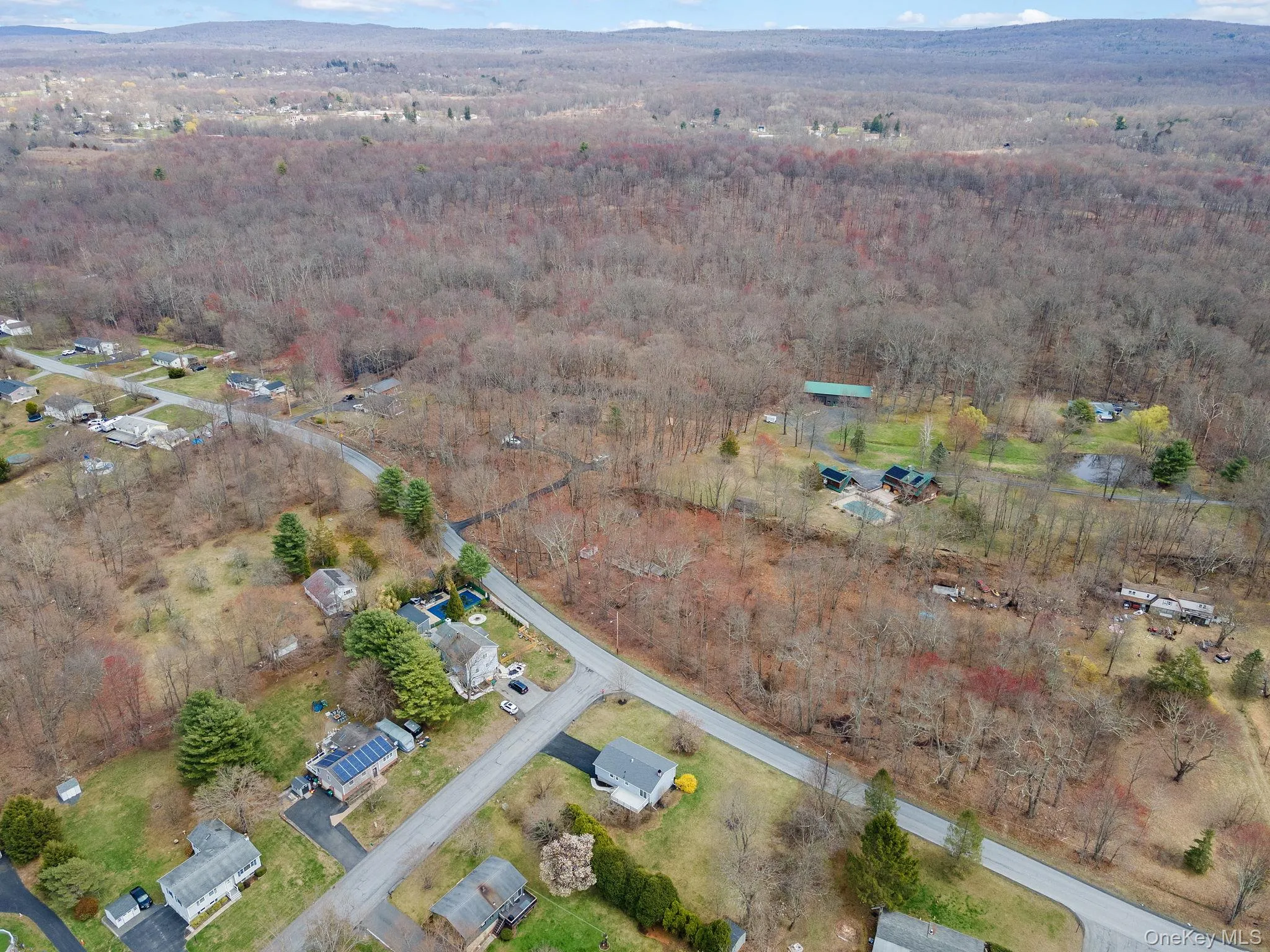 Birds eye view of property with a wooded view Birds eye view of property with a wooded view