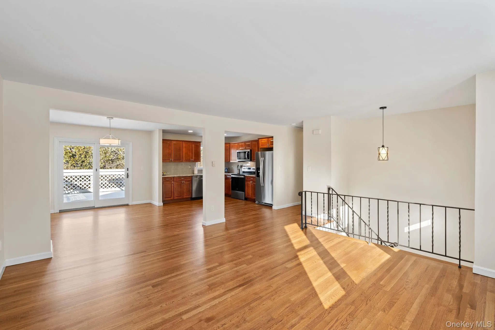 Unfurnished living room with light hardwood / wood-style floors Unfurnished living room with light hardwood / wood-style floors