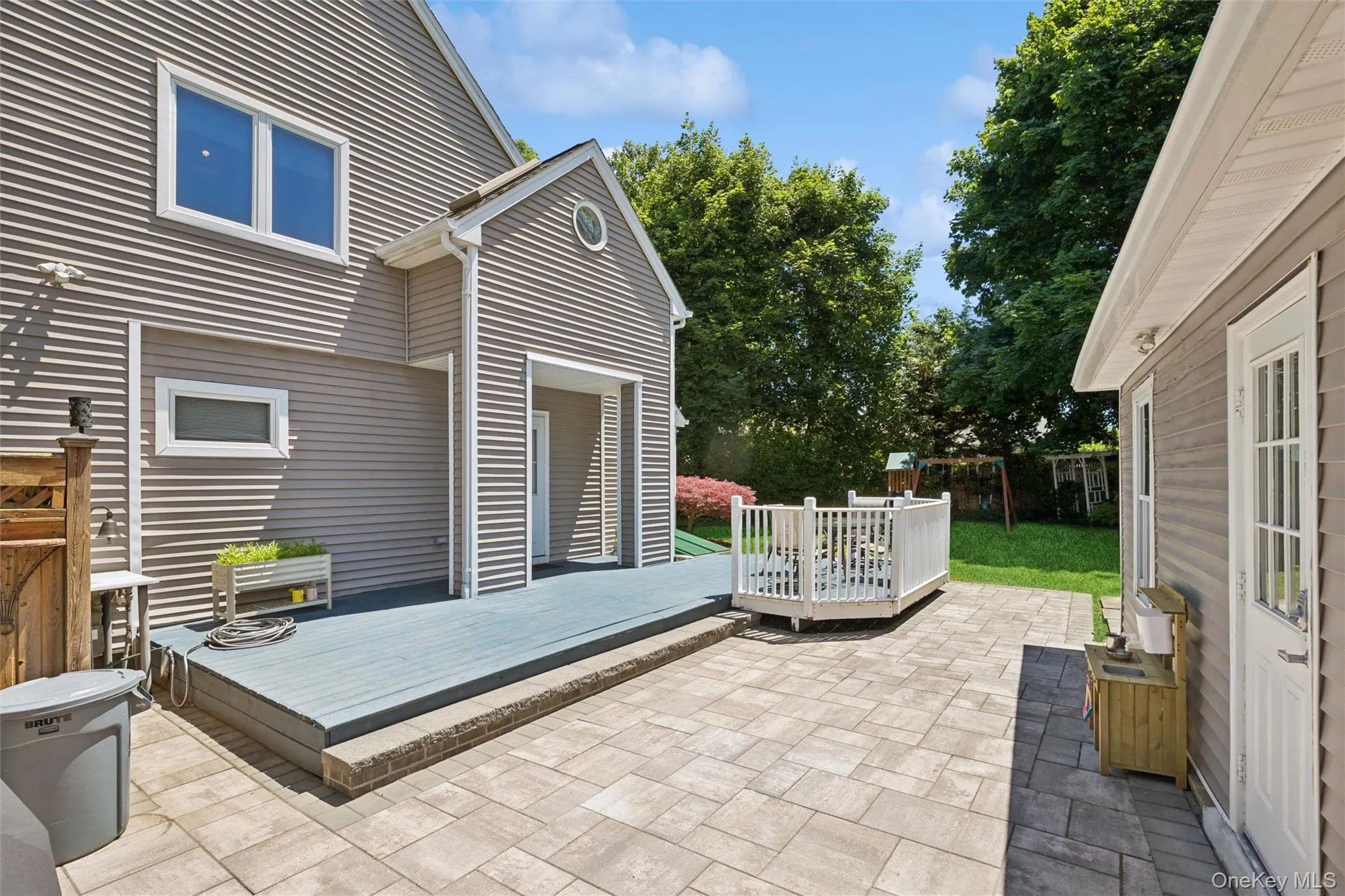 Belgium paver patio and trex decking Belgium paver patio and trex decking