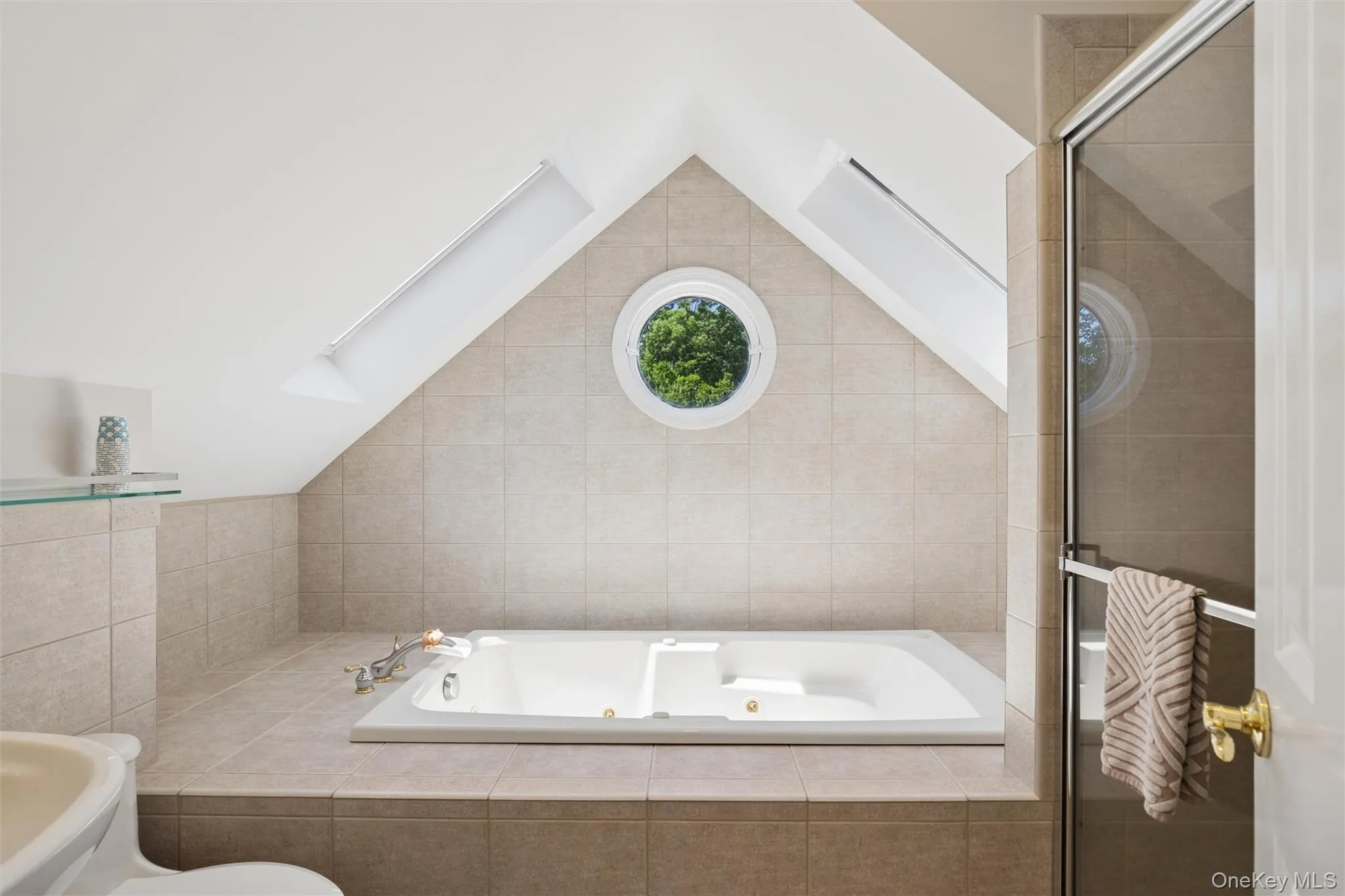 Full bath with jacuzzi tub and walk in shower on second floor Full bath with jacuzzi tub and walk in shower on second floor