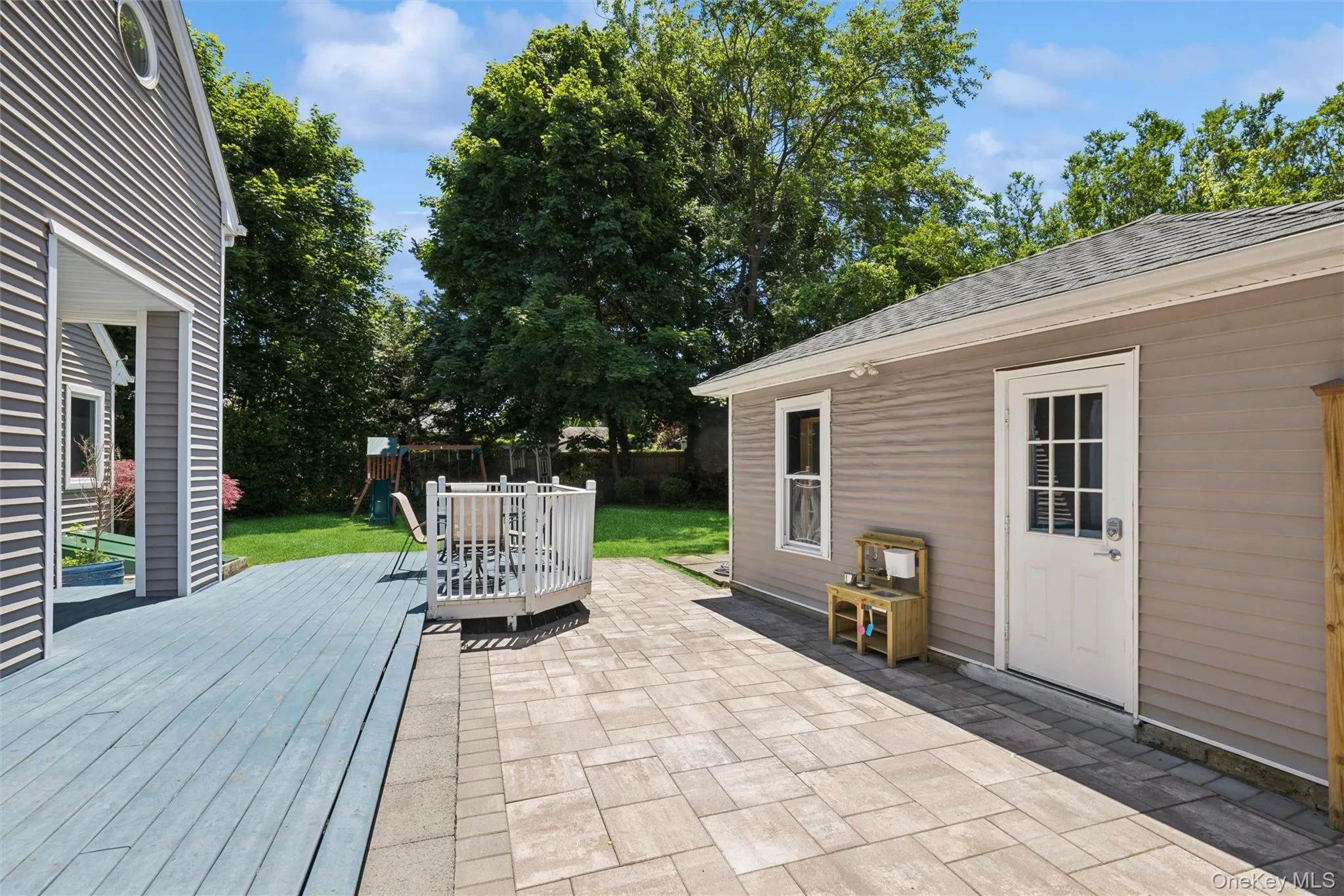 Belgium paver patio and trex decking -2 car garage entrance Belgium paver patio and trex decking -2 car garage entrance