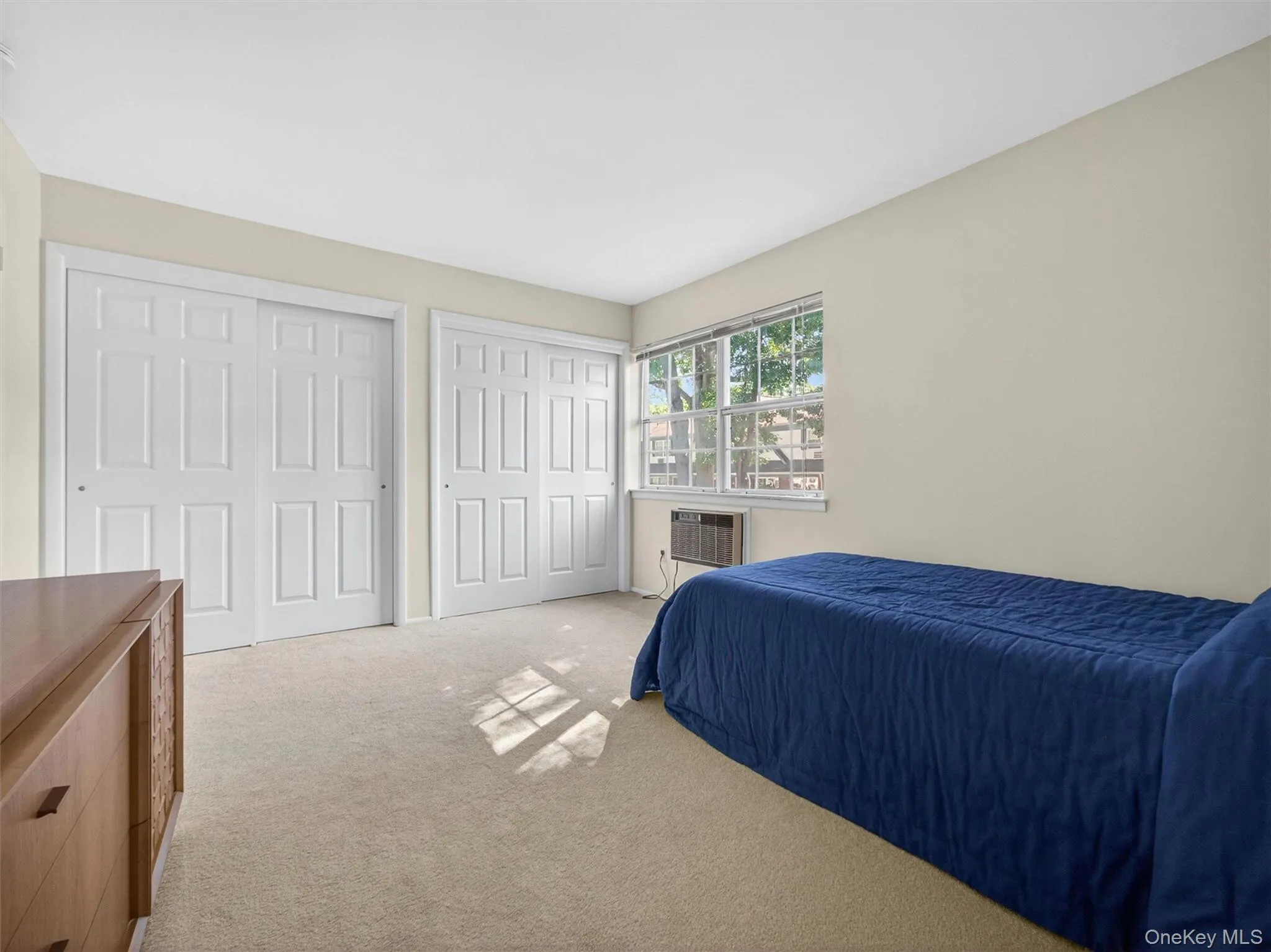 Second bedroom featuring double closets for exceptional storage. Second bedroom featuring double closets for exceptional storage.
