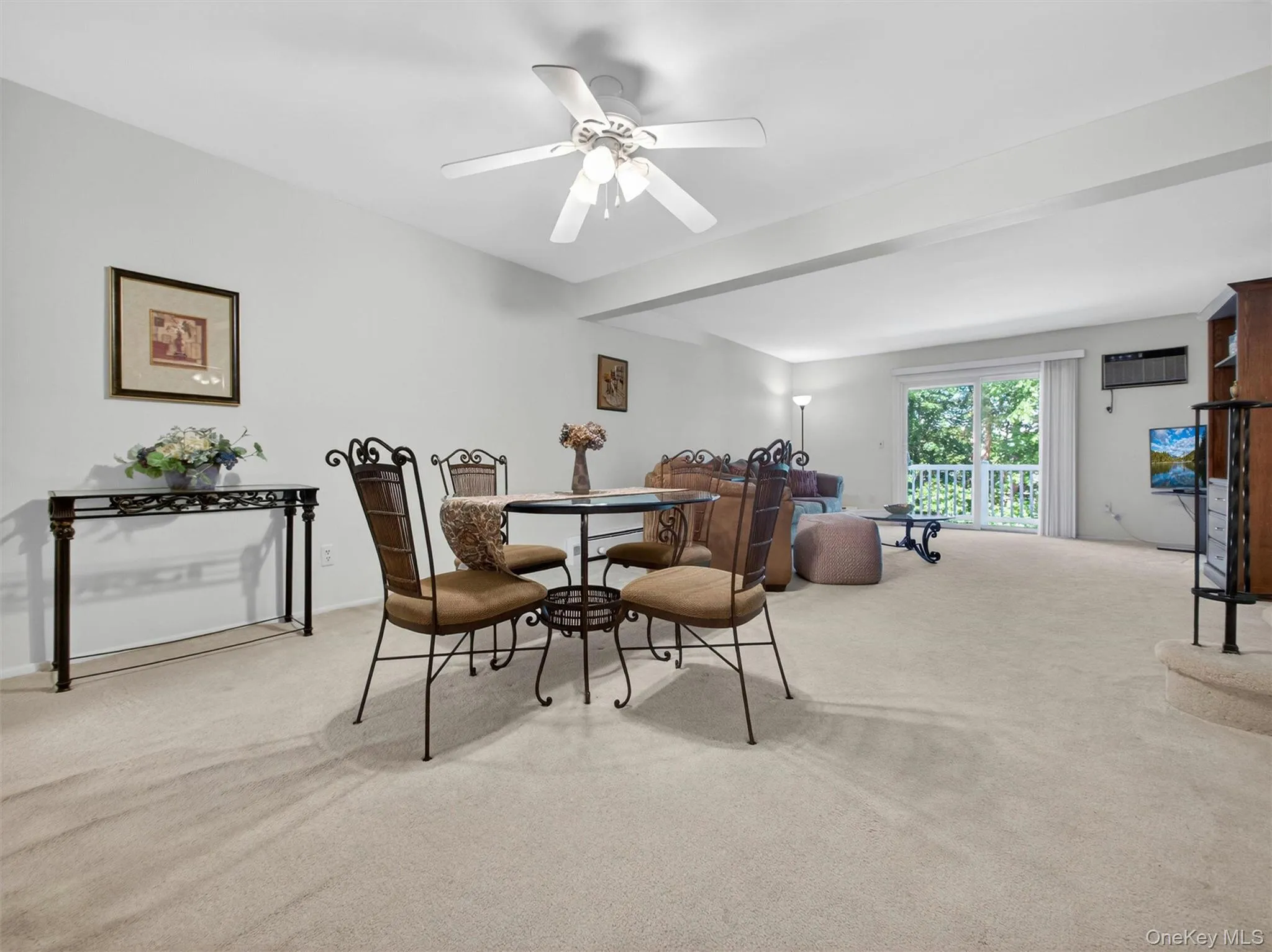 Expansive living and dining area with abundant natural light and access to private outdoor space. Expansive living and dining area with abundant natural light and access to private outdoor space.