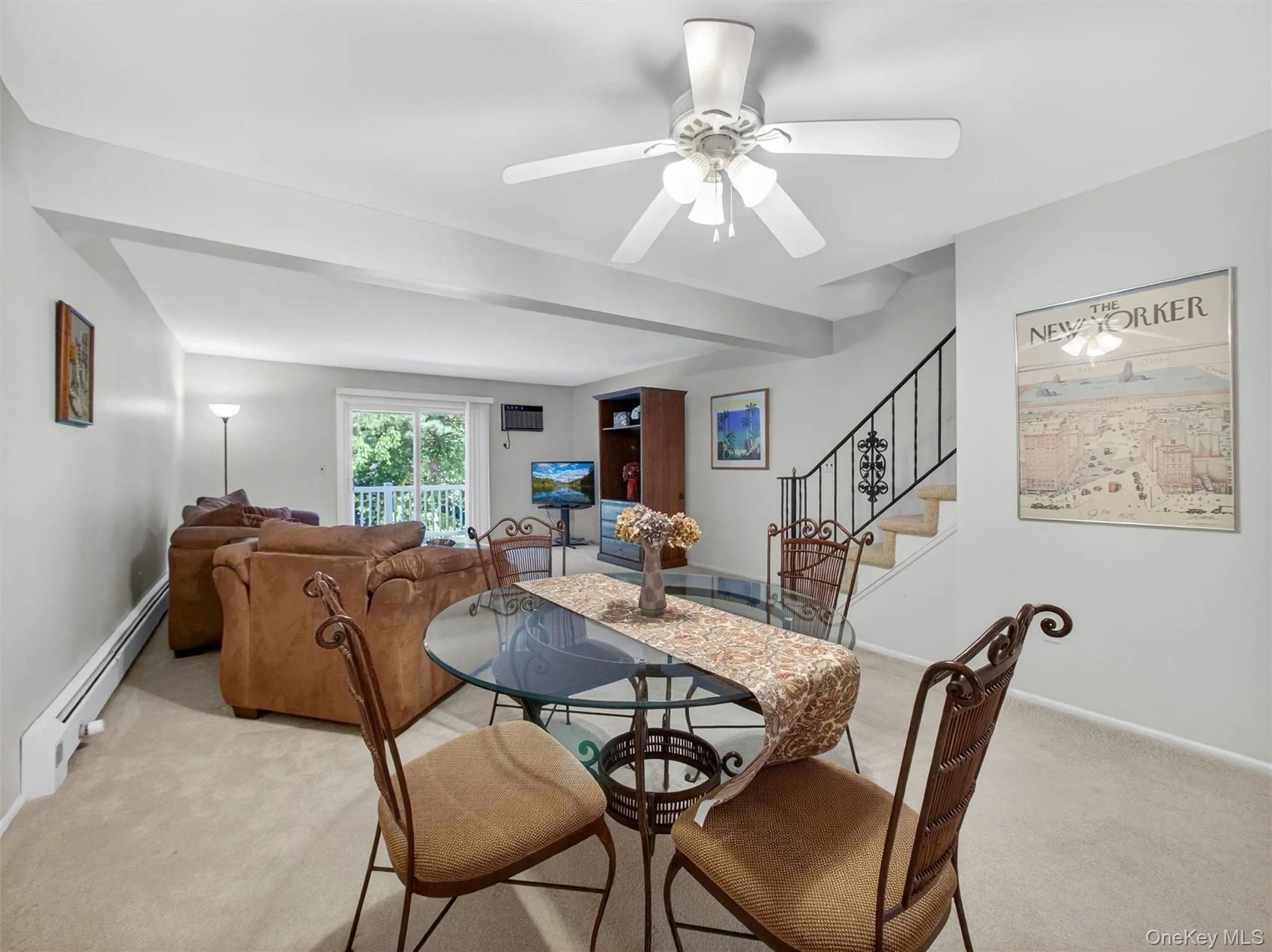 Alternate view of the spacious living and dining area showcasing the home's open layout. Alternate view of the spacious living and dining area showcasing the home's open layout.