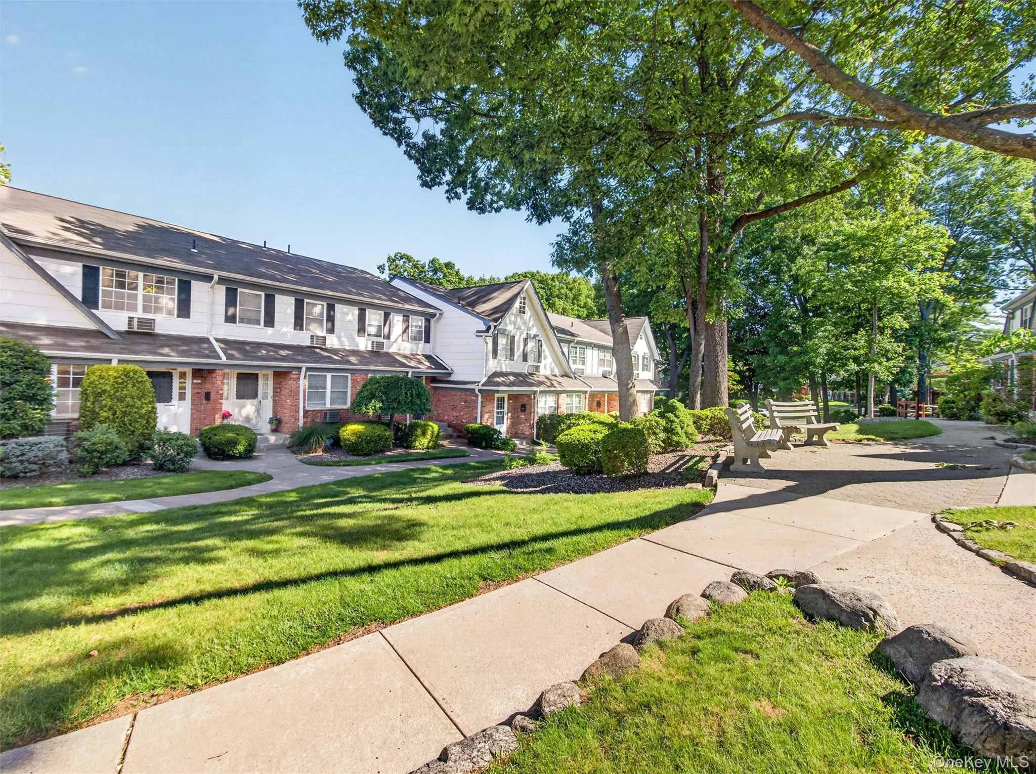 Beautifully landscaped community grounds with manicured lawns and mature shade trees. Beautifully landscaped community grounds with manicured lawns and mature shade trees.