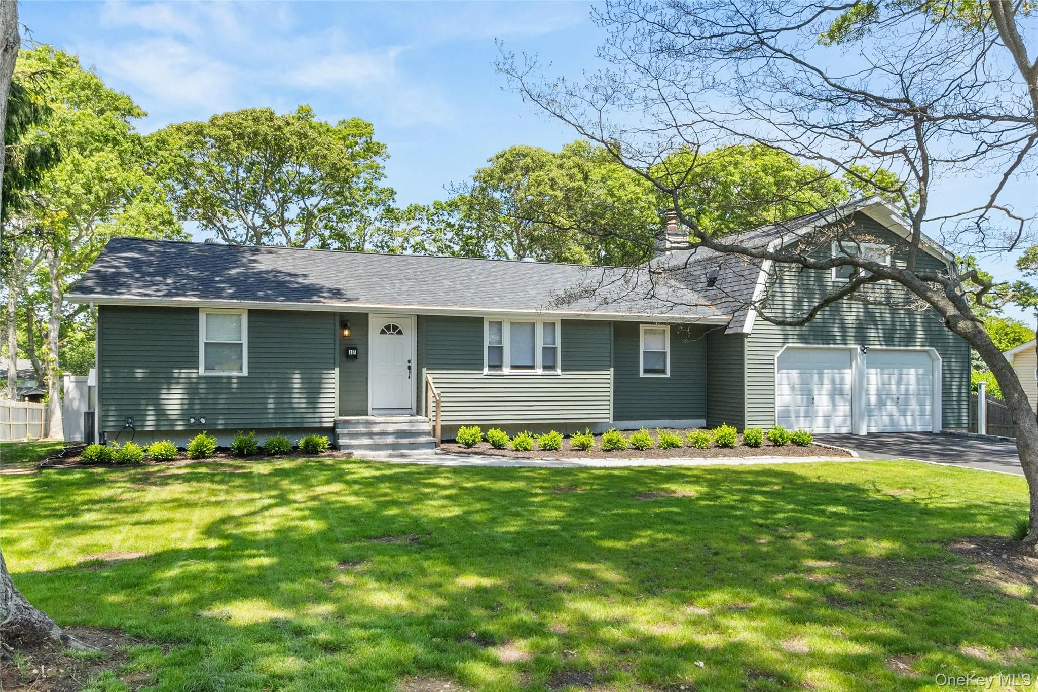 Inviting residence featuring a two-car garage and brand new roof Inviting residence featuring a two-car garage and brand new roof