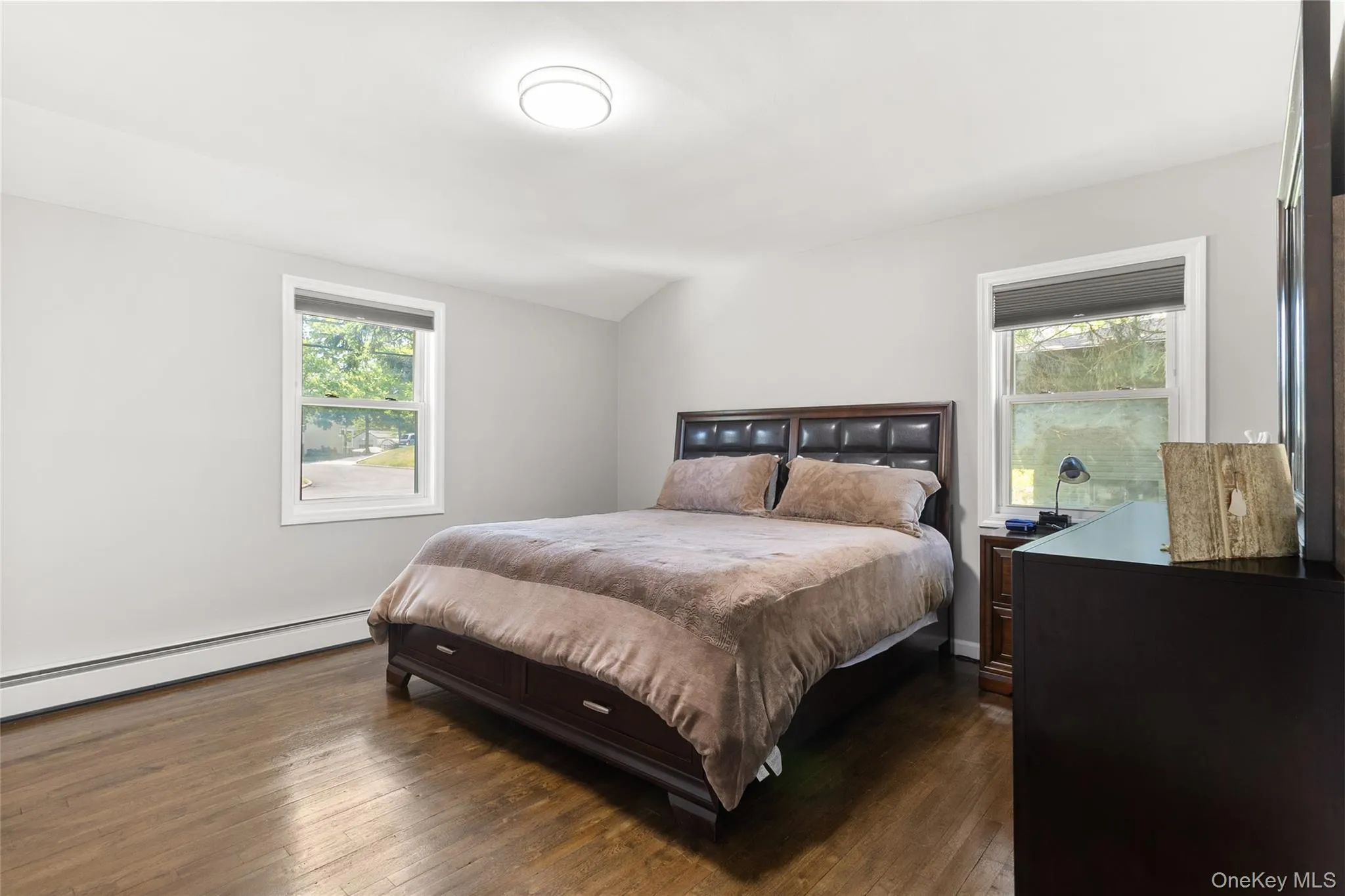 Hardwood flooring and light gray walls create a neutral backdrop Hardwood flooring and light gray walls create a neutral backdrop