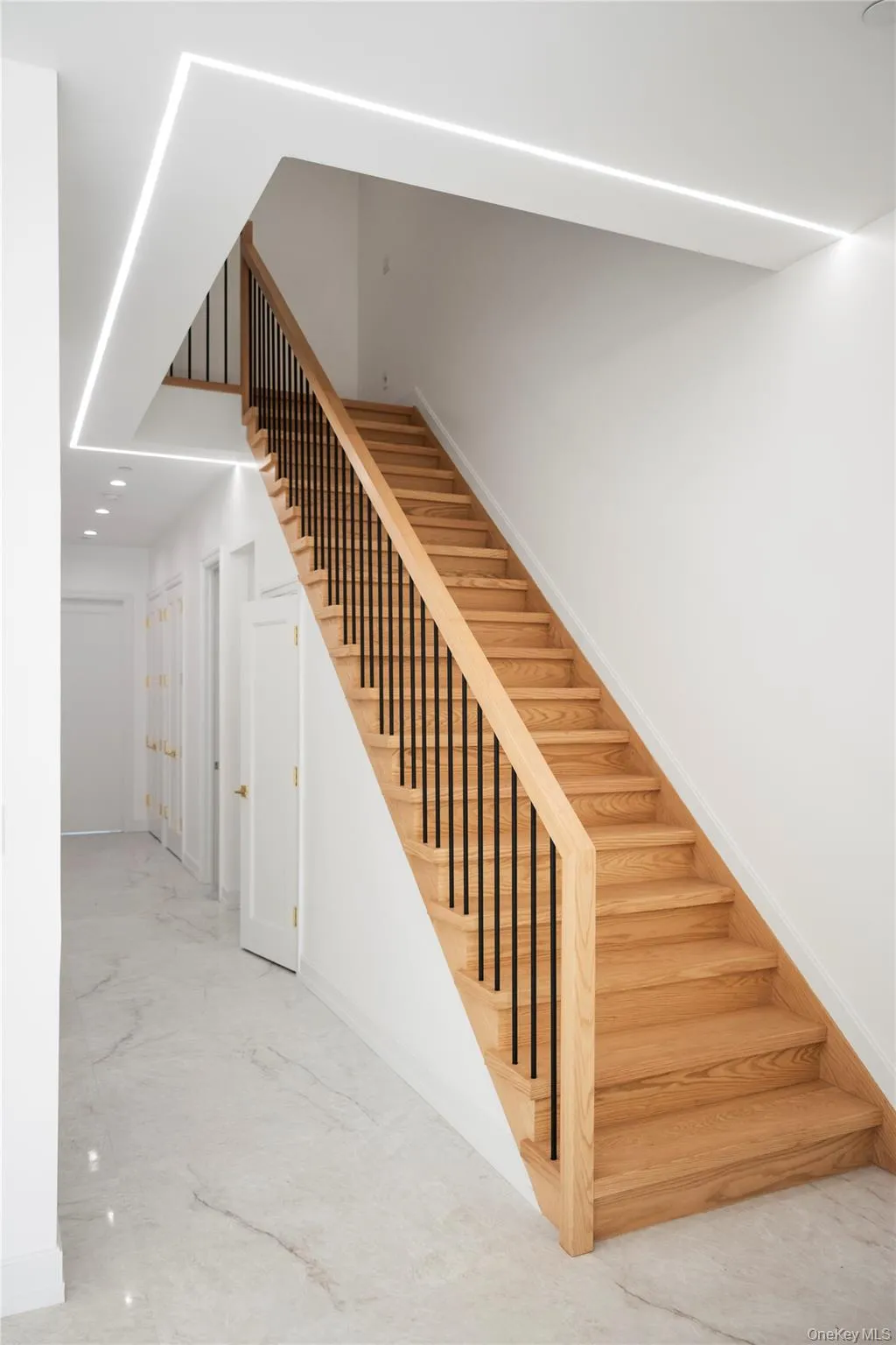 Stairs with baseboards and recessed lighting Stairs with baseboards and recessed lighting