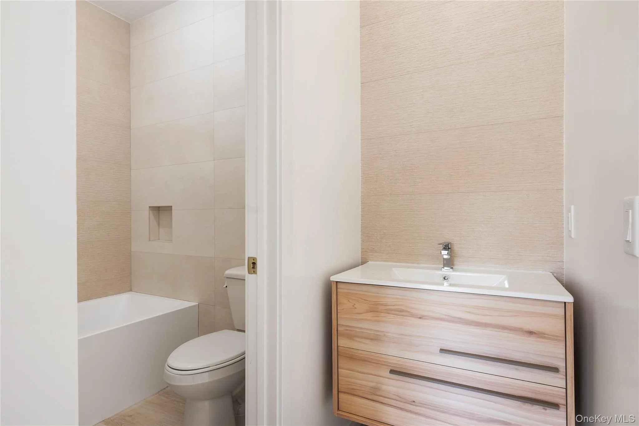 Full bath with vanity and toilet at guest apartment Full bath with vanity and toilet at guest apartment