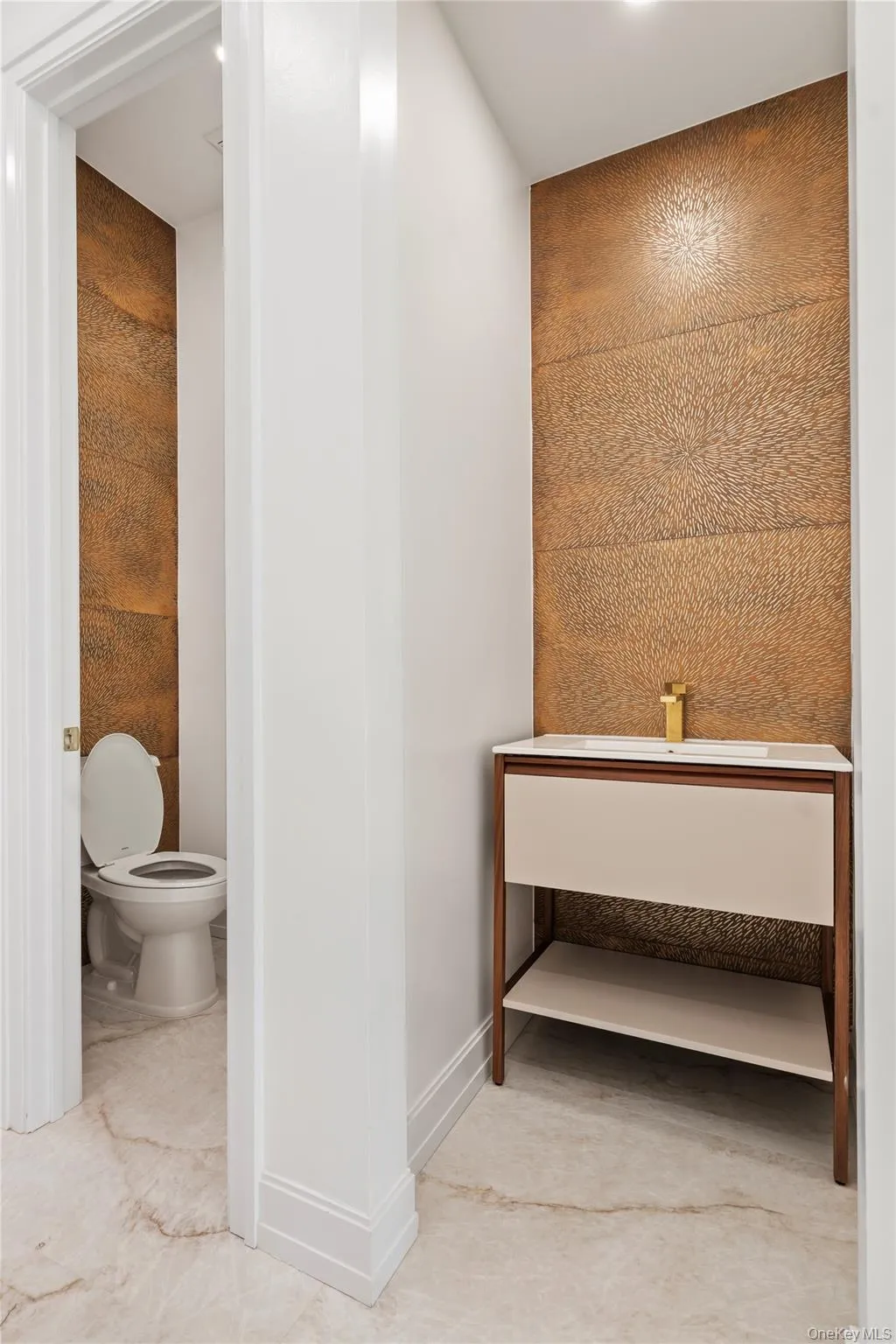 Bathroom with toilet and light tile patterned floors Bathroom with toilet and light tile patterned floors
