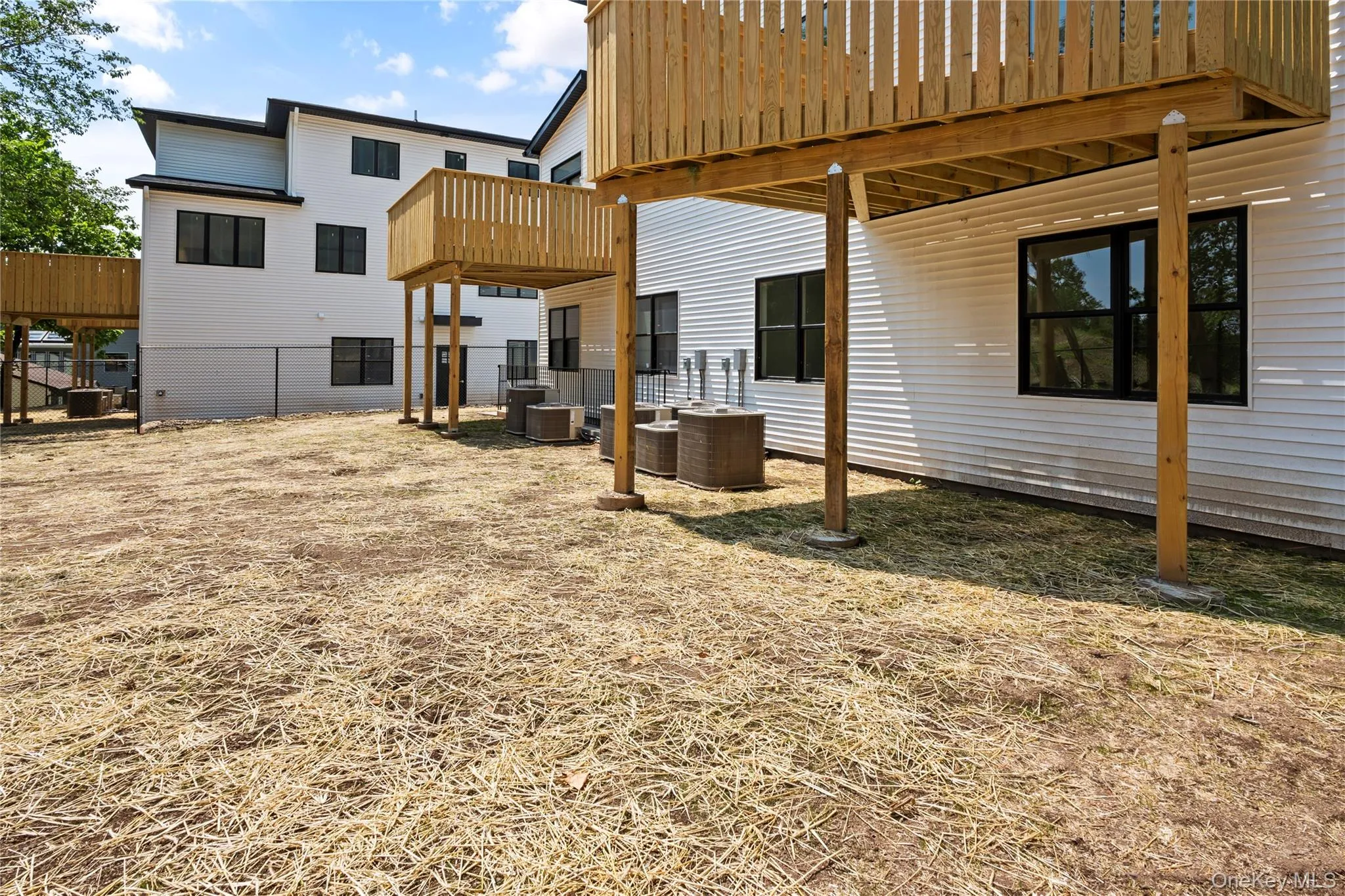 View of yard featuring a patio and a deck View of yard featuring a patio and a deck