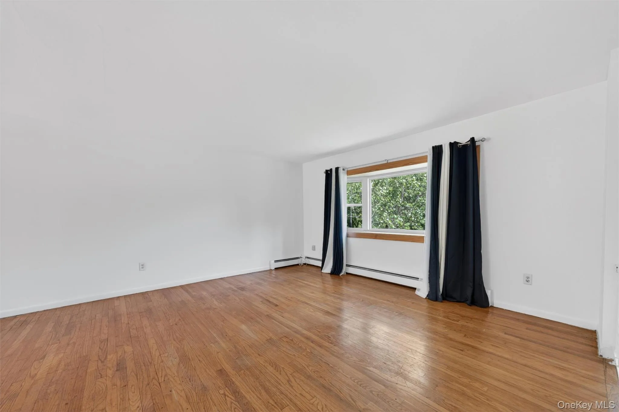 Plenty of space in this Open space main level featuring Hardwood Floors Plenty of space in this Open space main level featuring Hardwood Floors