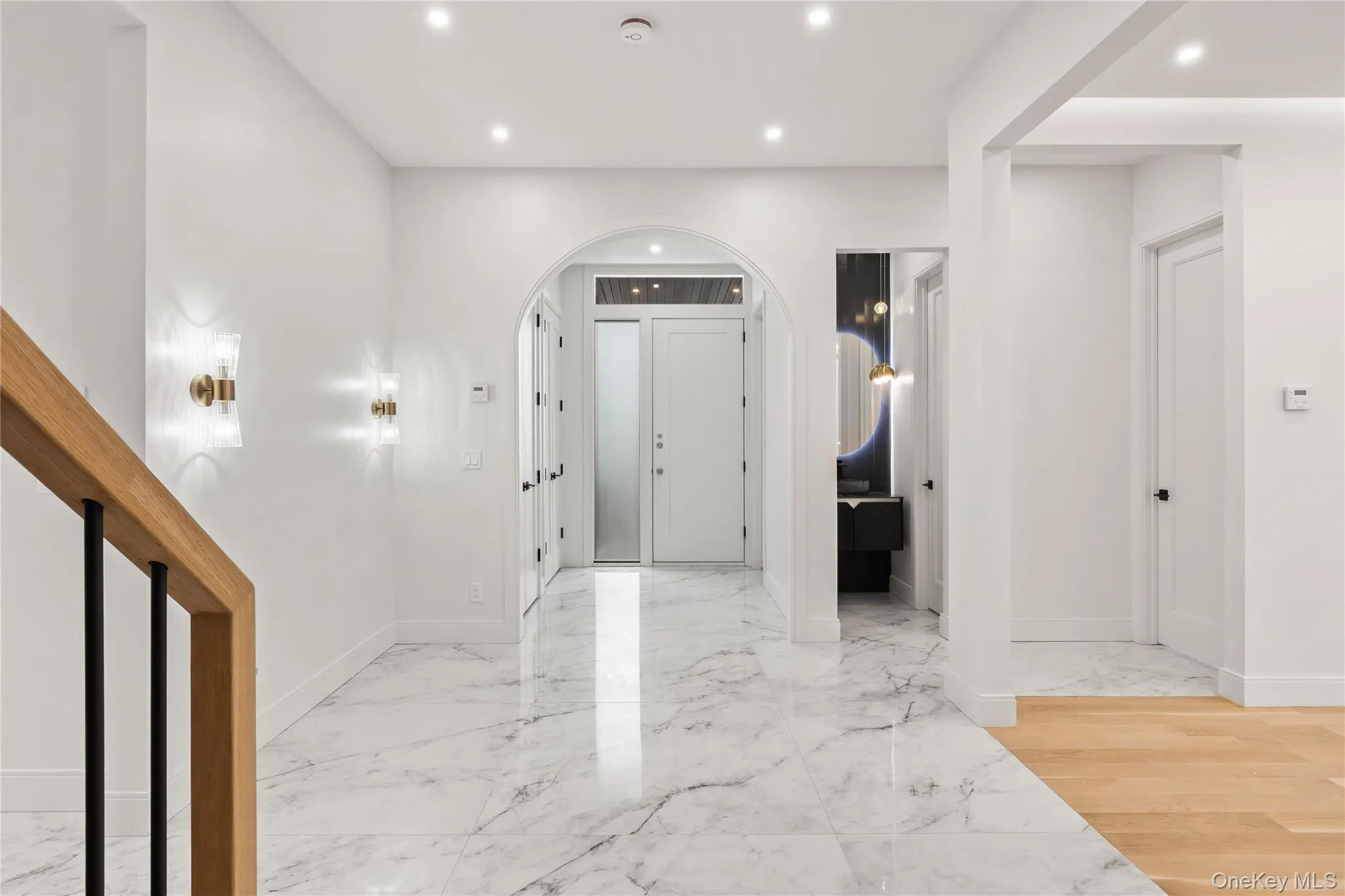 Entryway featuring marble-look tile flooring with radiant heatand recessed lighting Entryway featuring marble-look tile flooring with radiant heatand recessed lighting