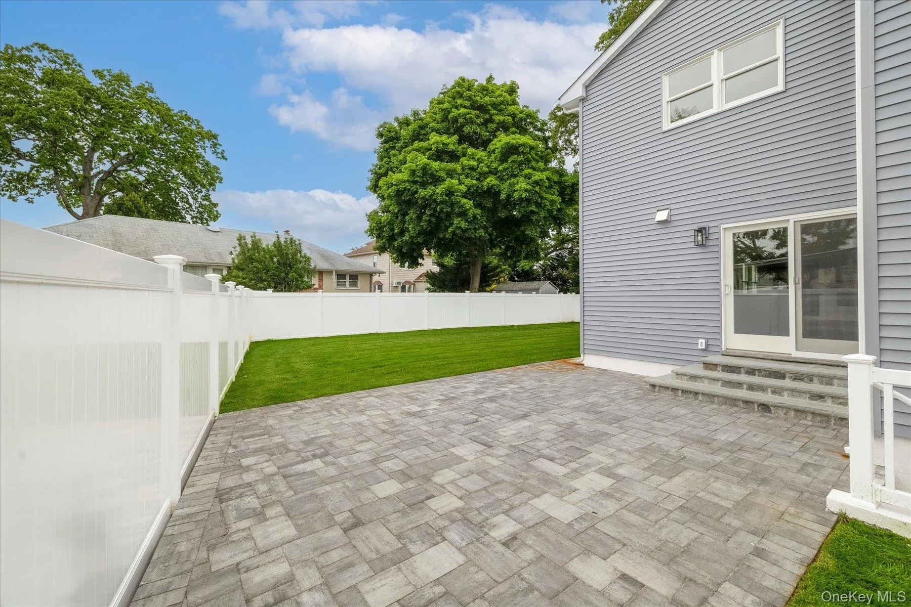 Beautiful patio accessed through the kitchens sliders Beautiful patio accessed through the kitchens sliders