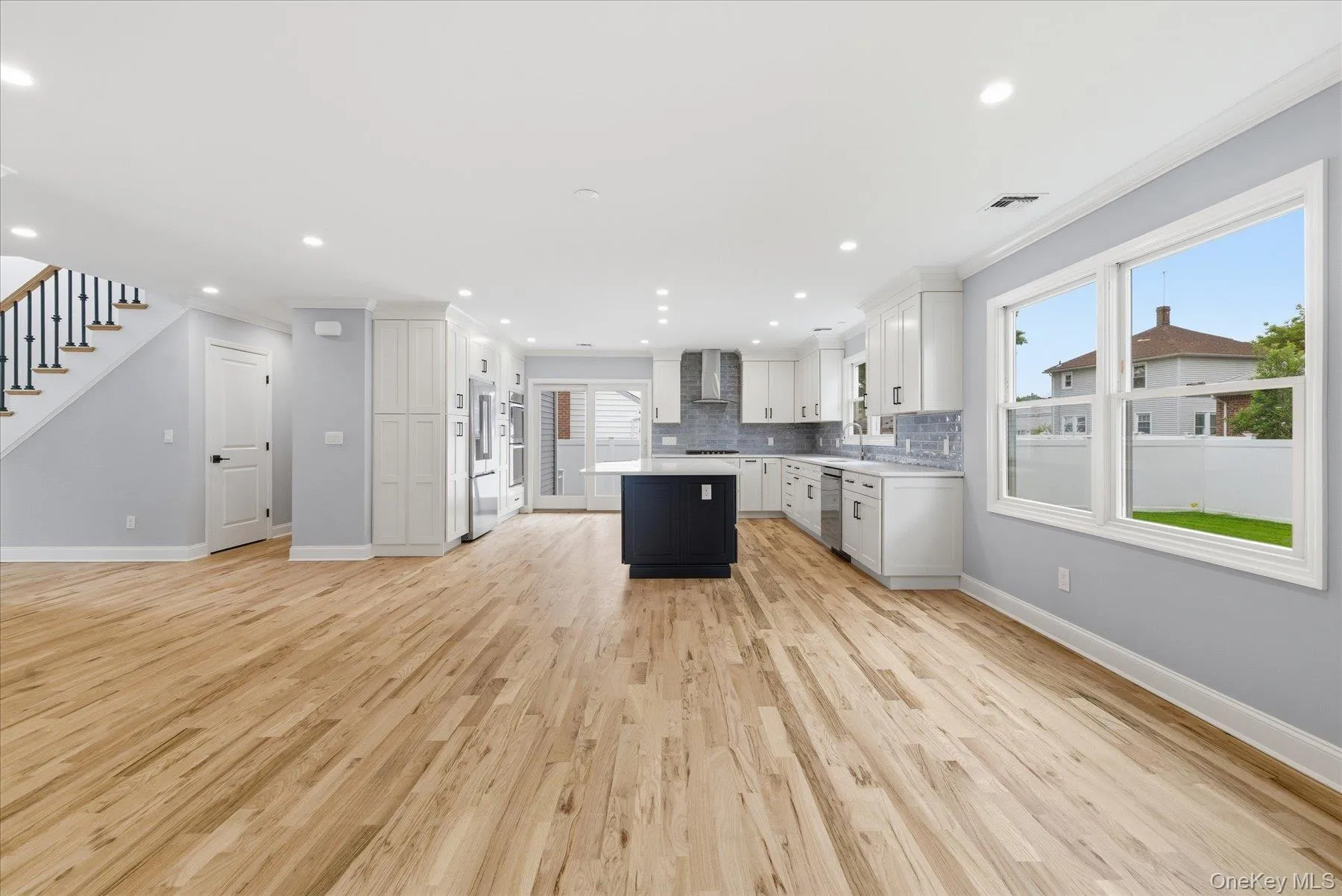 A spacious kitchen with ample space for cooking and entertaining A spacious kitchen with ample space for cooking and entertaining