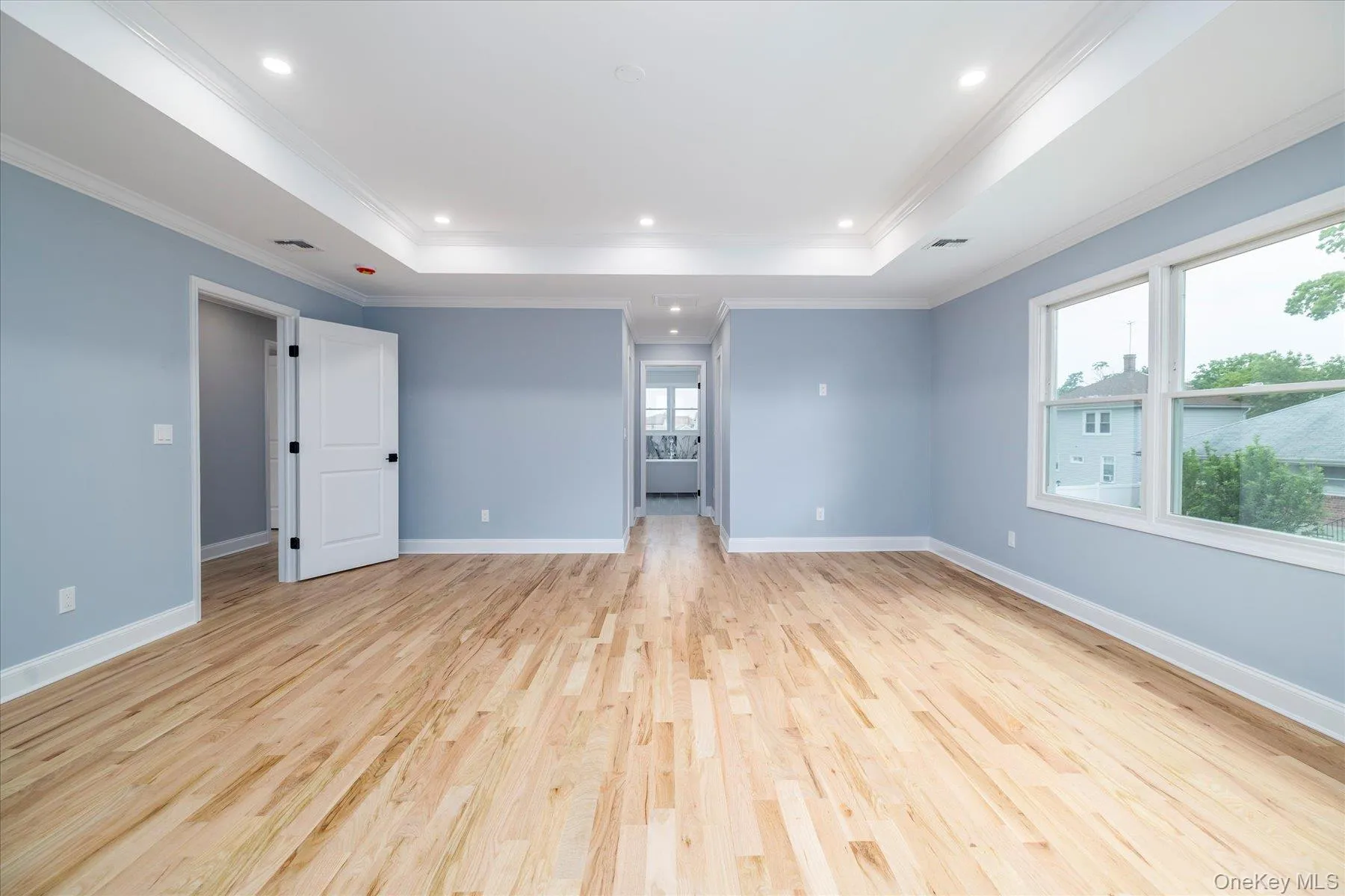 The sprawling primary bedroom suite serves as an oasis The sprawling primary bedroom suite serves as an oasis