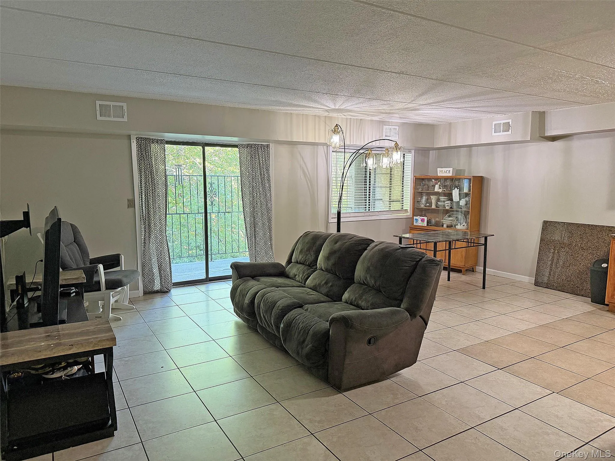 Sunny open-concept living, dining room and eat-in-kitchen. Sunny open-concept living, dining room and eat-in-kitchen.