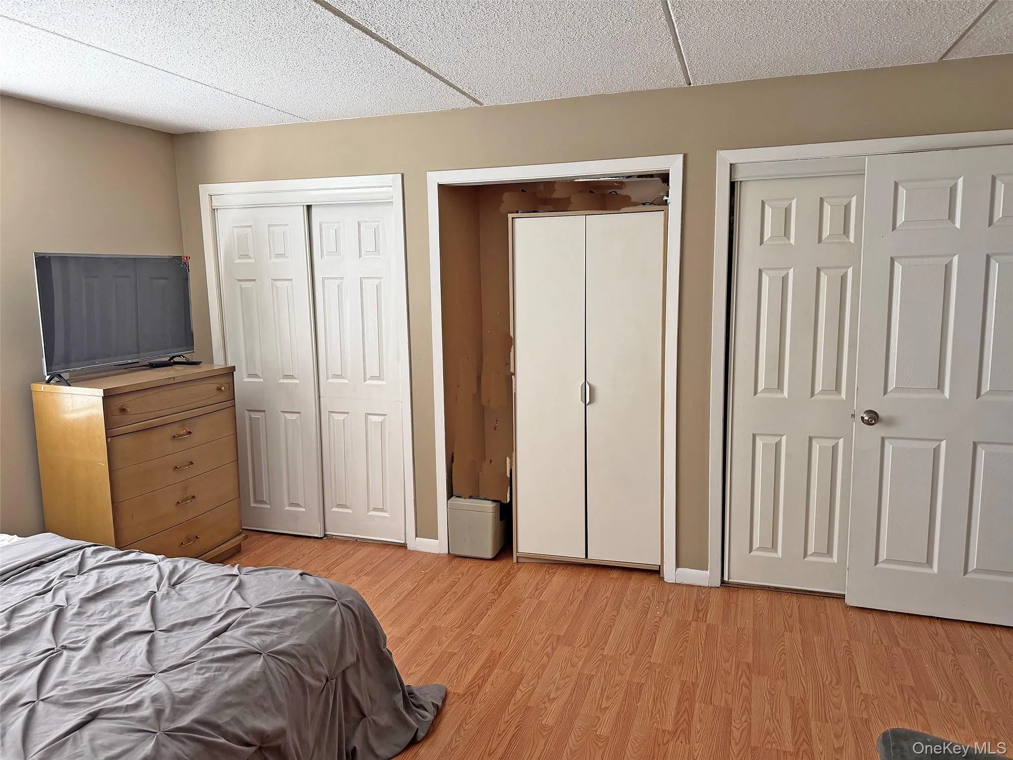 Primary bedroom with lovely flooring and large closets. Primary bedroom with lovely flooring and large closets.