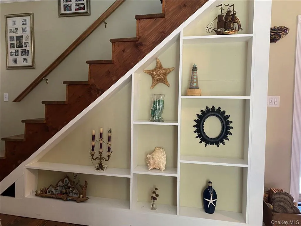 Staircase featuring built in shelves Staircase featuring built in shelves