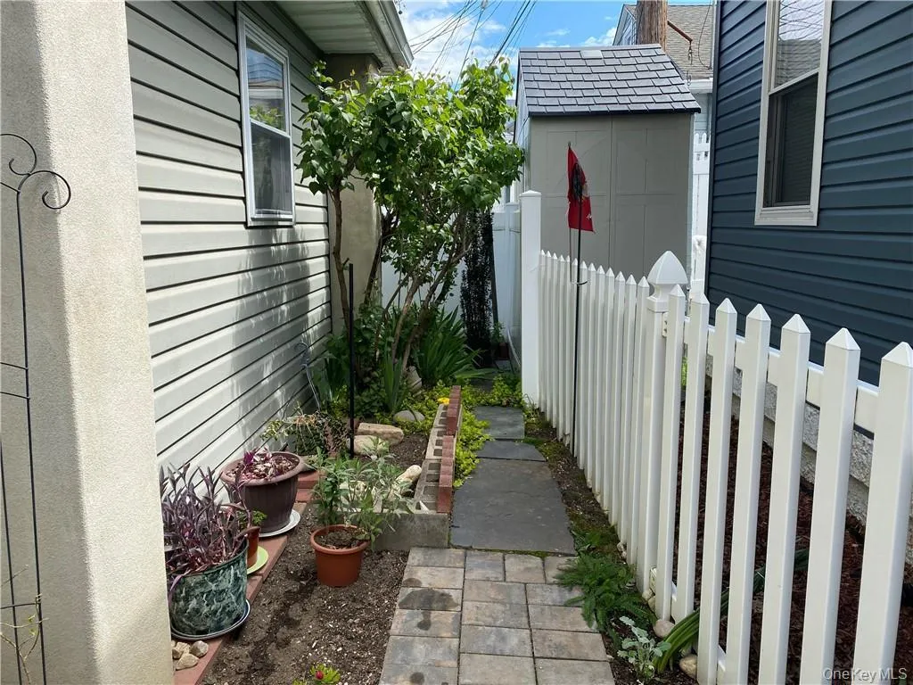 View of side of property with flowers View of side of property with flowers