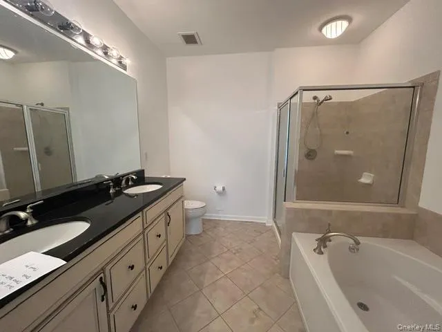 Master bathroom with double vanity, soaking tub, and large shower. Master bathroom with double vanity, soaking tub, and large shower.